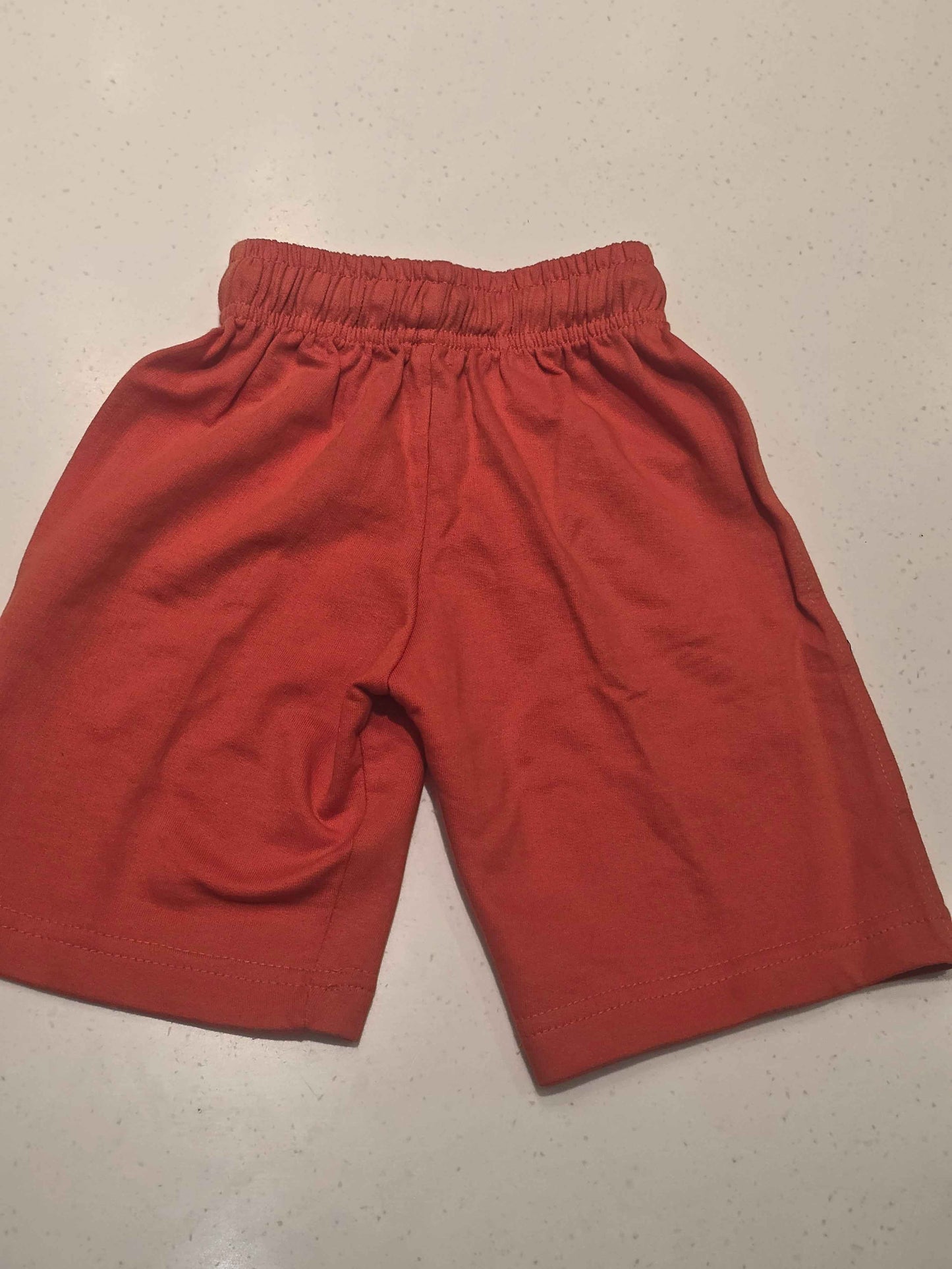 Pure cotton material orange coloured ¾ with prints and round Elasticable