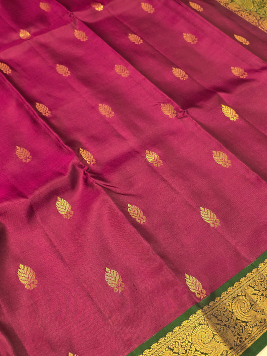 Handloom pure Kanjivaram silk with small leaf styled motifs and small traditional peacock designed border, rich pallu