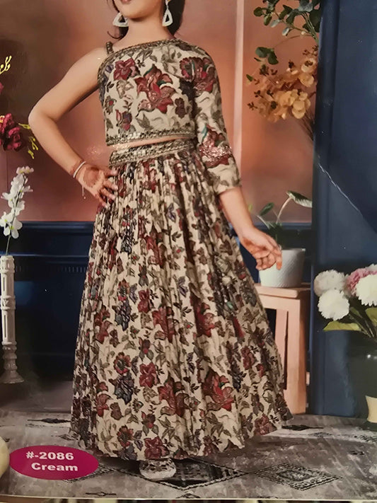 Crepe material cream based gaghra with printed floral & zari work over the body. Right shoulder with speghetti left had full sleeves