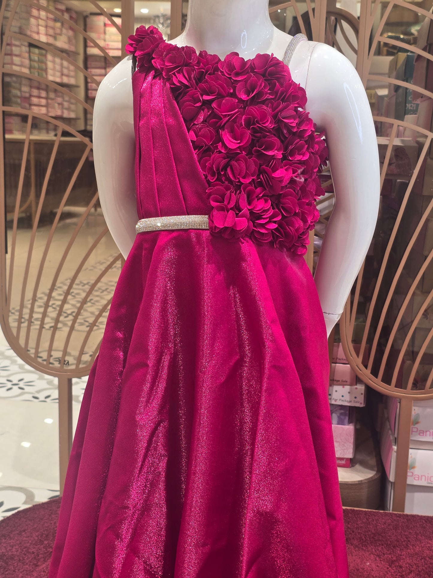 Rani Pink Satin Party Wear Gown for Girls with Spaghetti Strap Style and Half-Side Rose Design