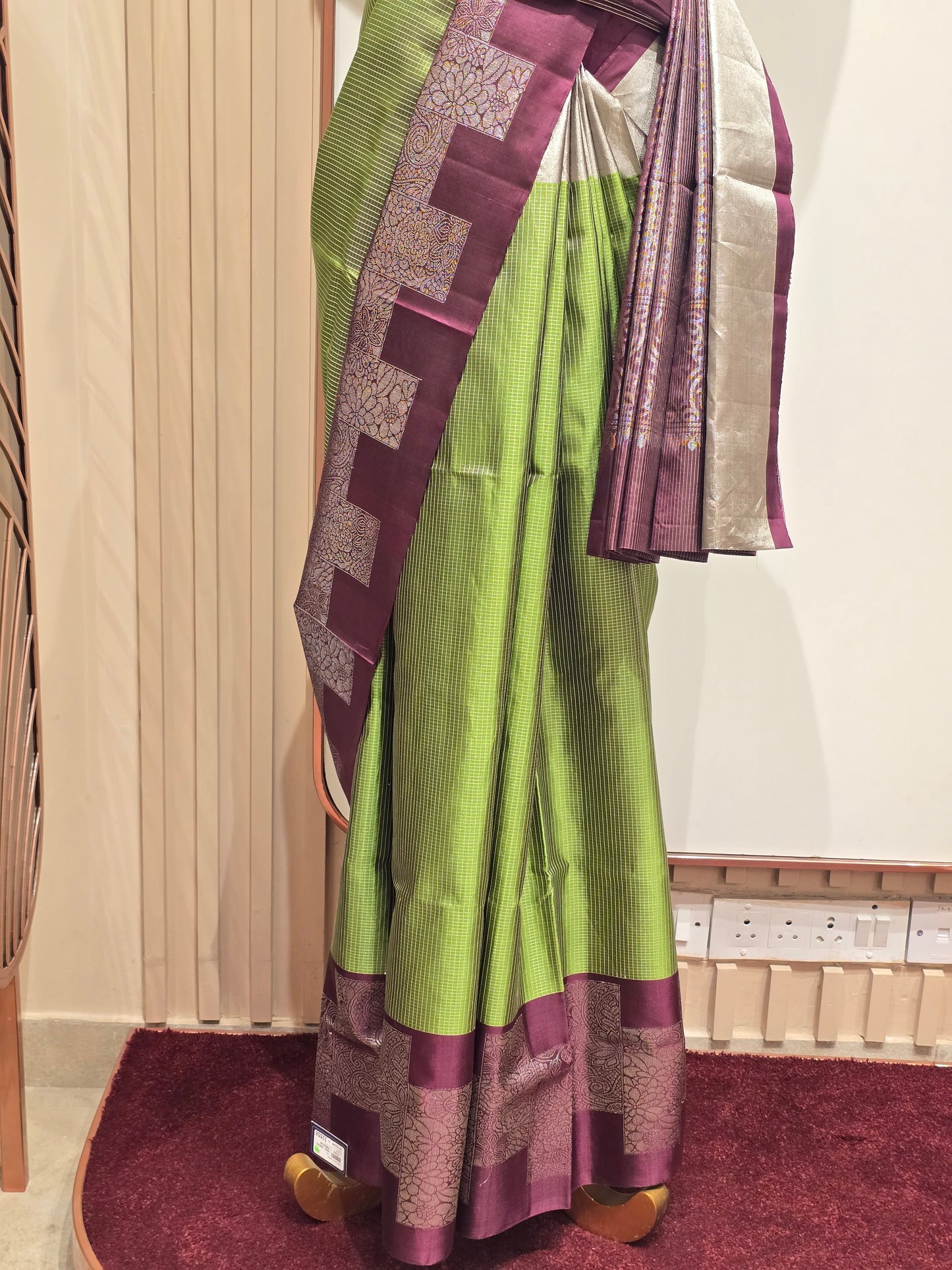South Indian Kanchipuram silk saree styled with a distinctive modern grid-patterned layout border