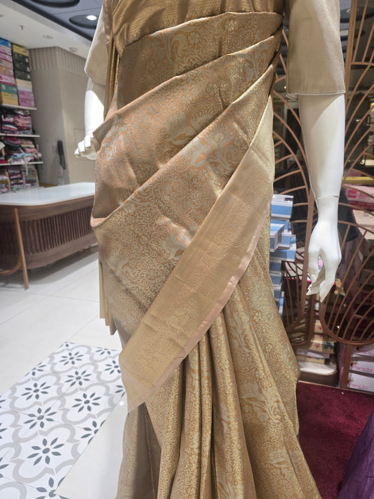 golden-toned semi silk saree.