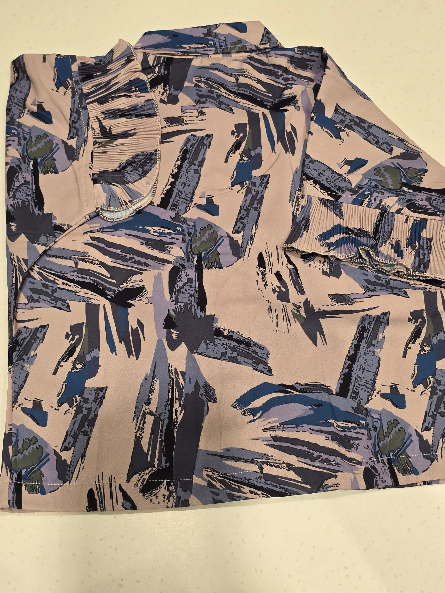 girls' casual short-sleeve shirt featuring a distinctive abstract brushstroke print in shades of blue, grey, and khaki on a beige base