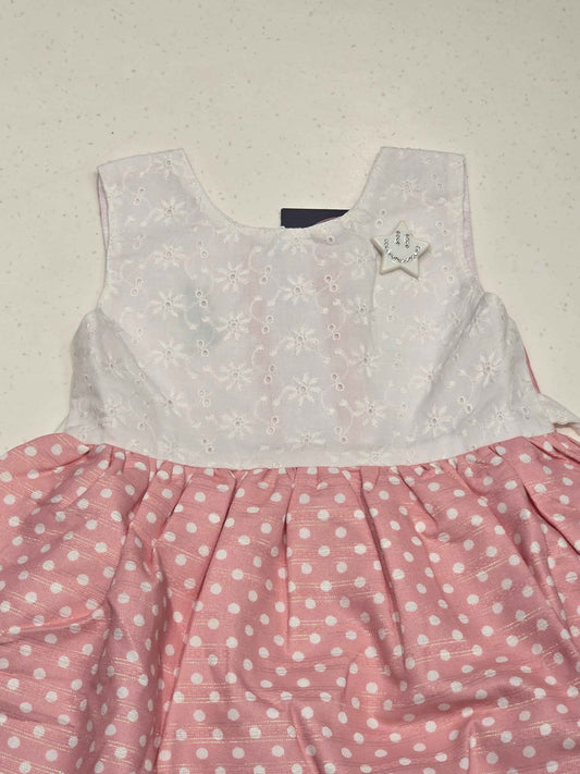 sleeveless, fit-and-flare baby cotton frock dress featuring a color-blocked style.