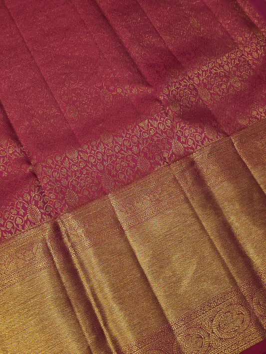 Pure handloom kanjivaram brocade Rani pink coloured silk saree with golden fancy design over the body and rich pallu