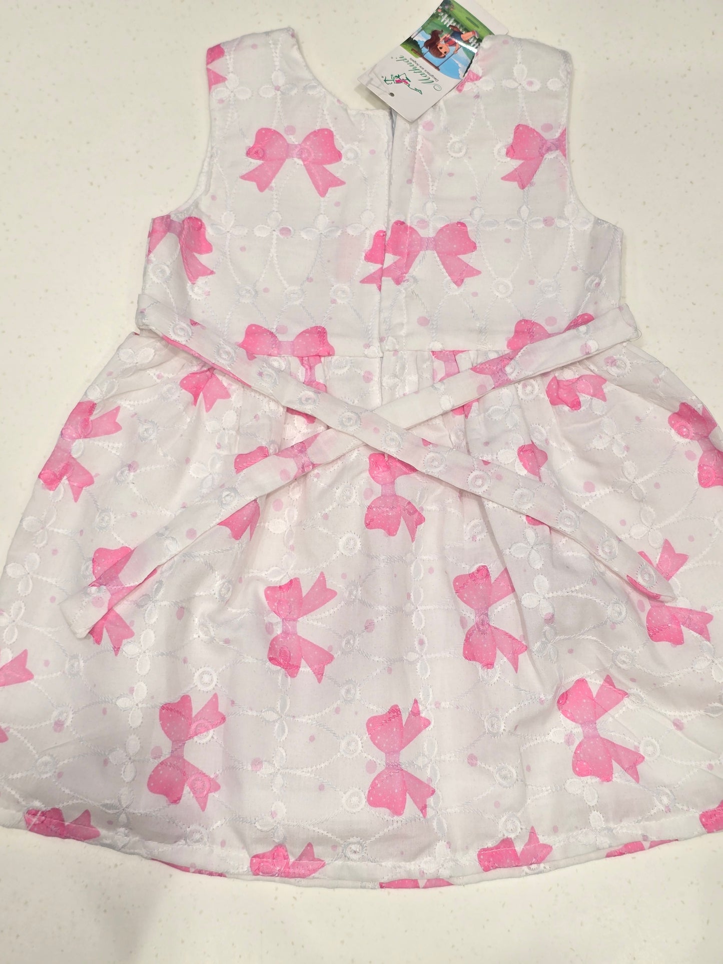 Cotton material white color with pink printed bow Baby frock