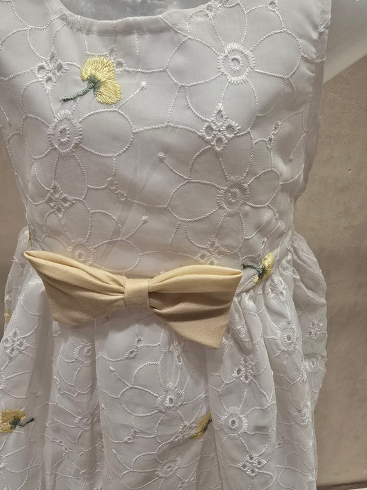 White shiffon fabric with acrobat design with waist yellow bow sleeves less casual wear