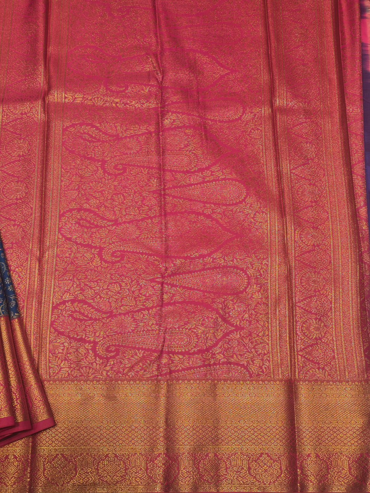 royal blue and rani pink semi-silk saree featuring rich gold zari brocade weaving.