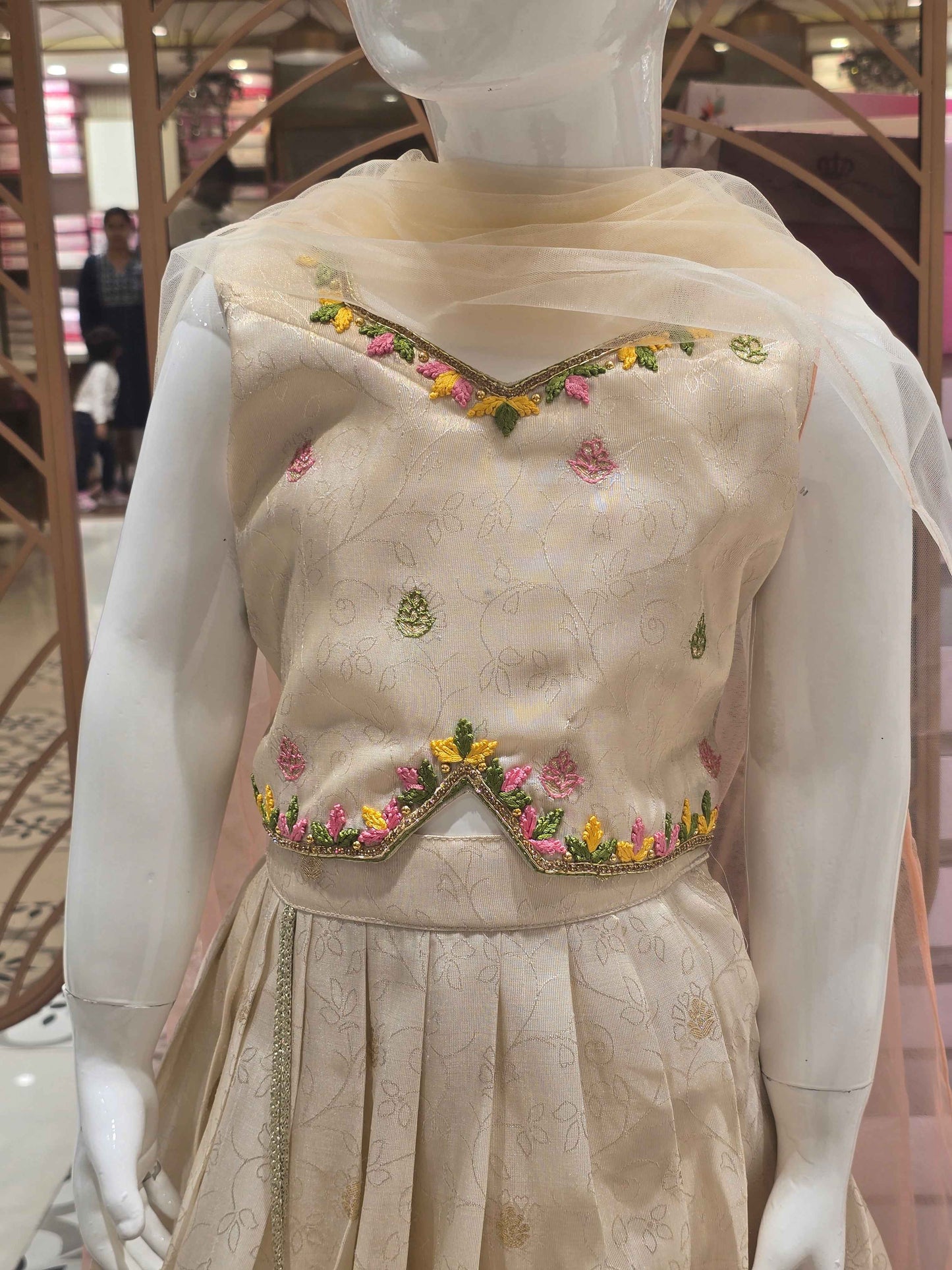 Tissue silk material cream colour ethnic wear with floral prints for garghra and long traditional border. star neck had thread work