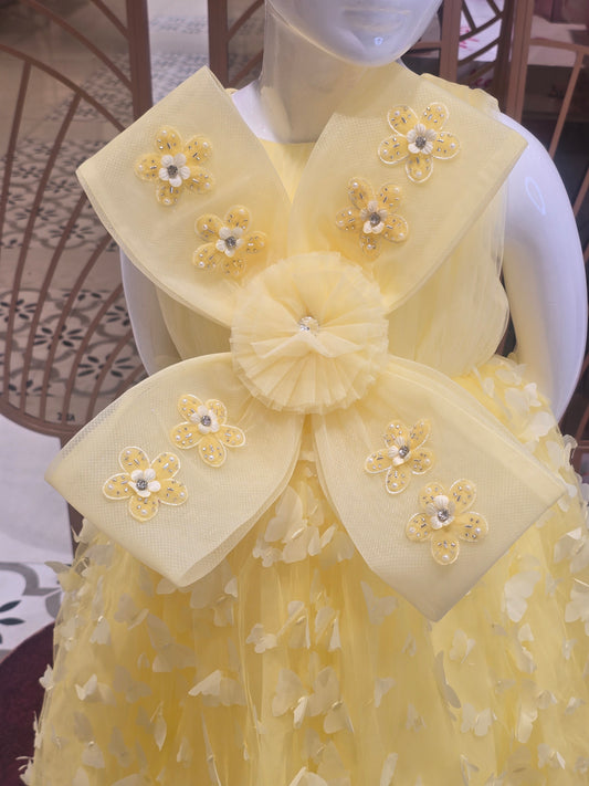 Lemon Yellow Knitted Party Wear Gown for Girls with Butterfly Cutwork Design and Detachable Flower Detail