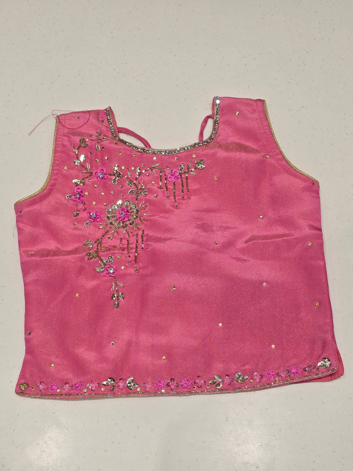 pink and gold lehenga choli set for kids (also known as a Pattu Pavadai