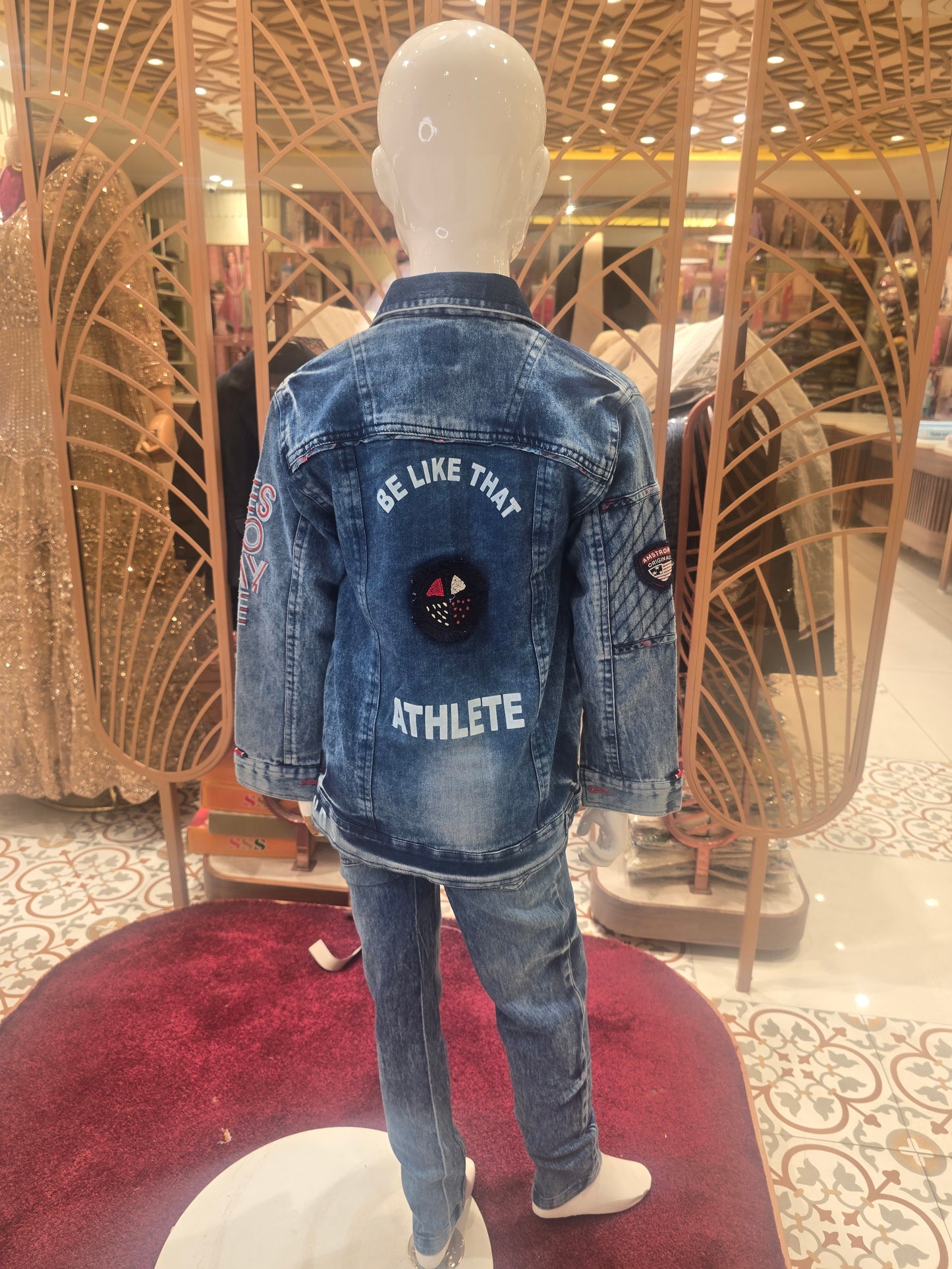 Shaded blue colored pure denim madren jacket with back stylish prints inner side red colored printed t-shirt and denim pant