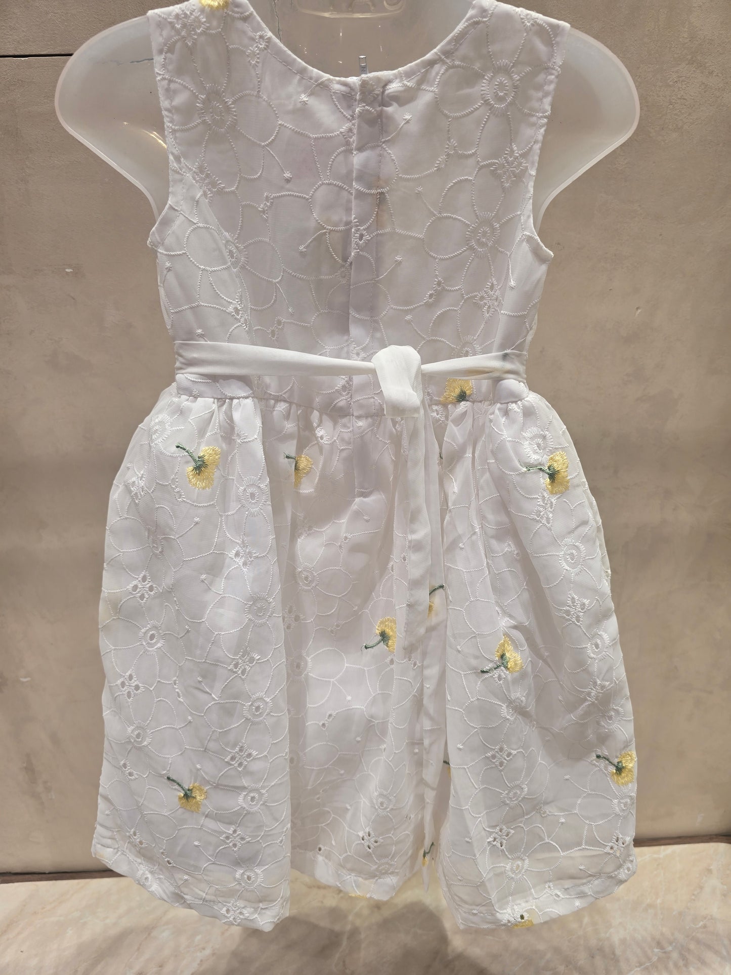 White shiffon fabric with acrobat design with waist yellow bow sleeves less casual wear