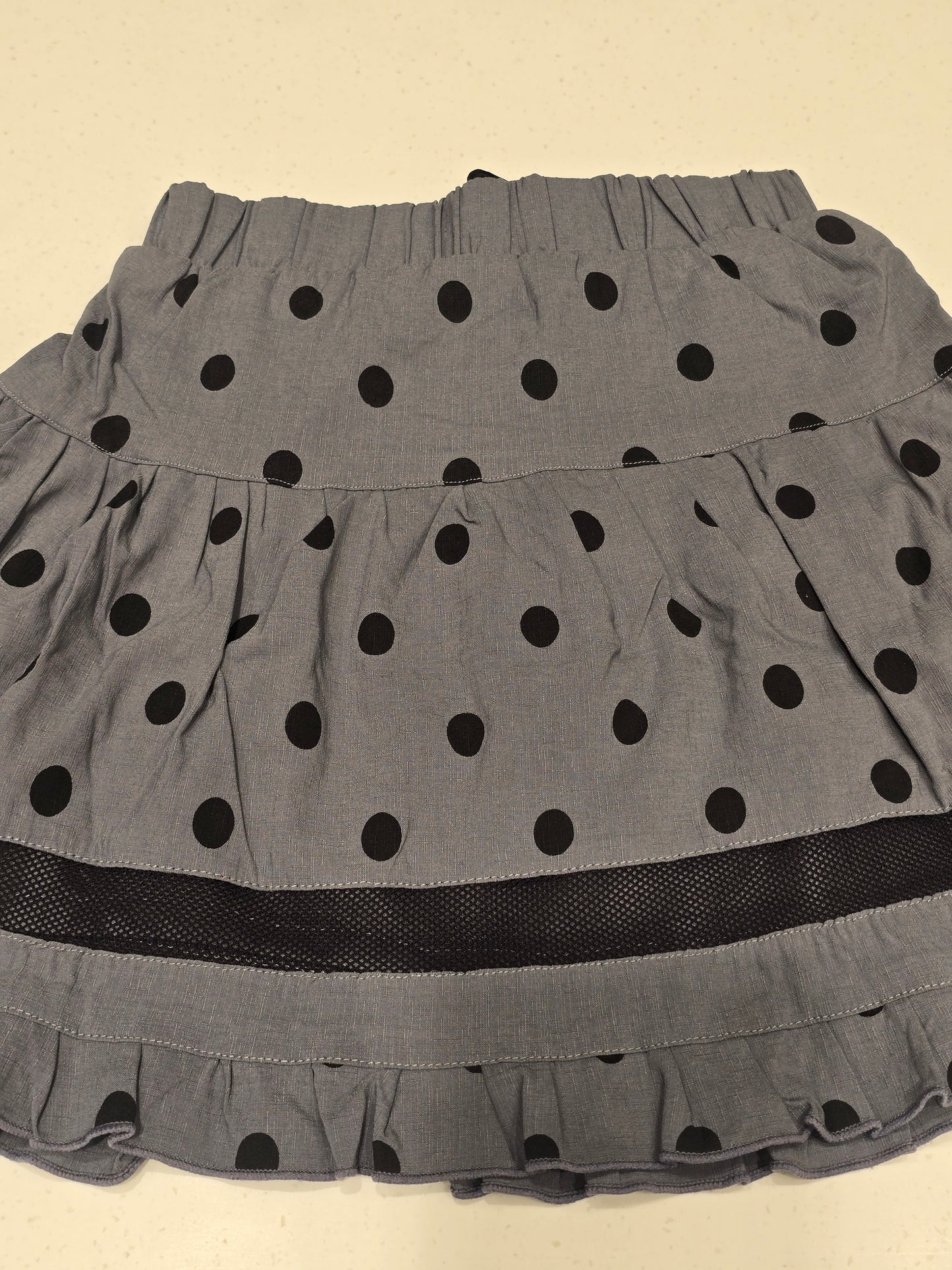 grey tiered mini skirt with black polka dots