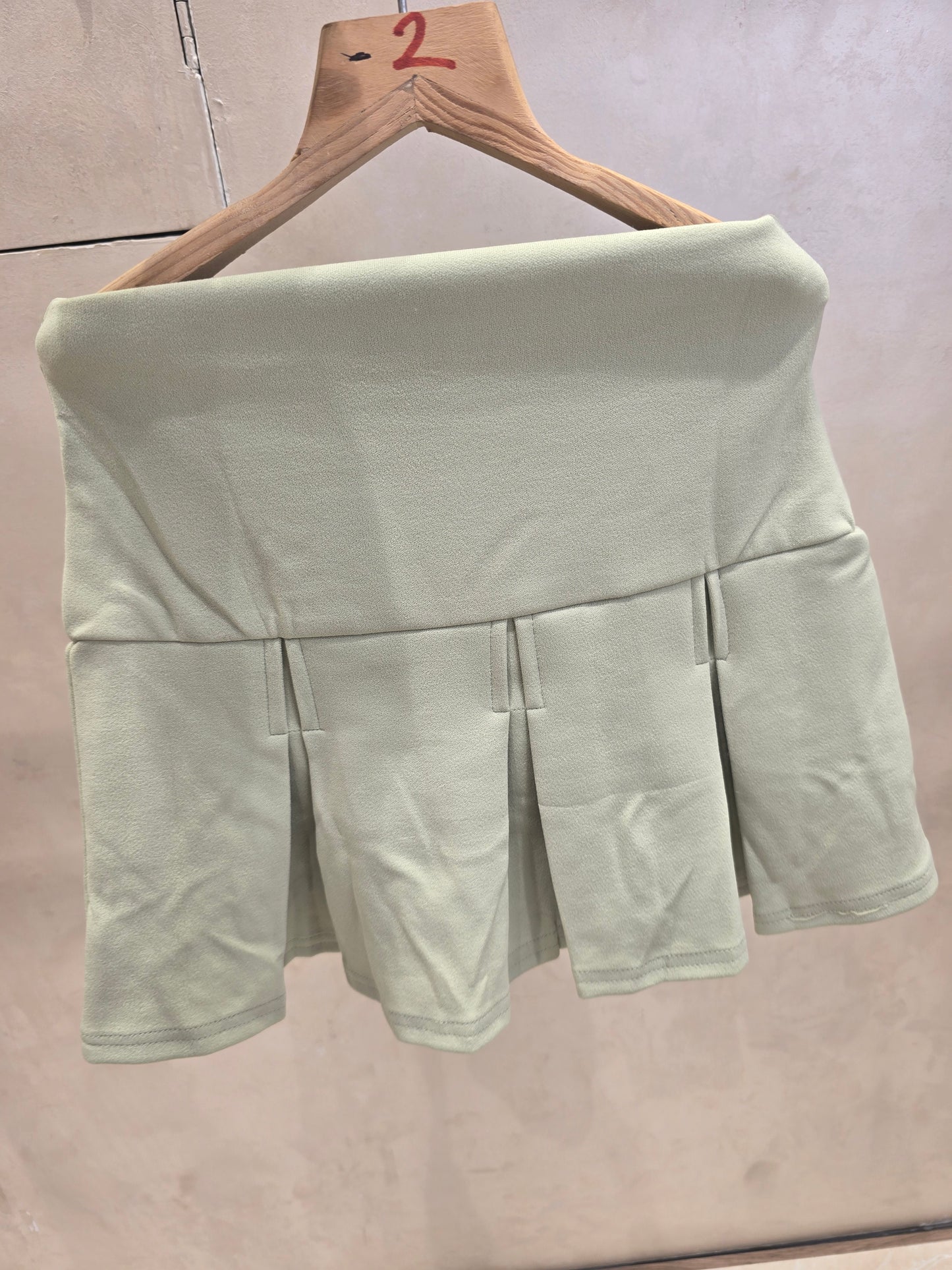 Girls Lycra Casual Wear Mini Skirt in Pista Green with Stylish Printed Border and Designer Belt for Summer Wear