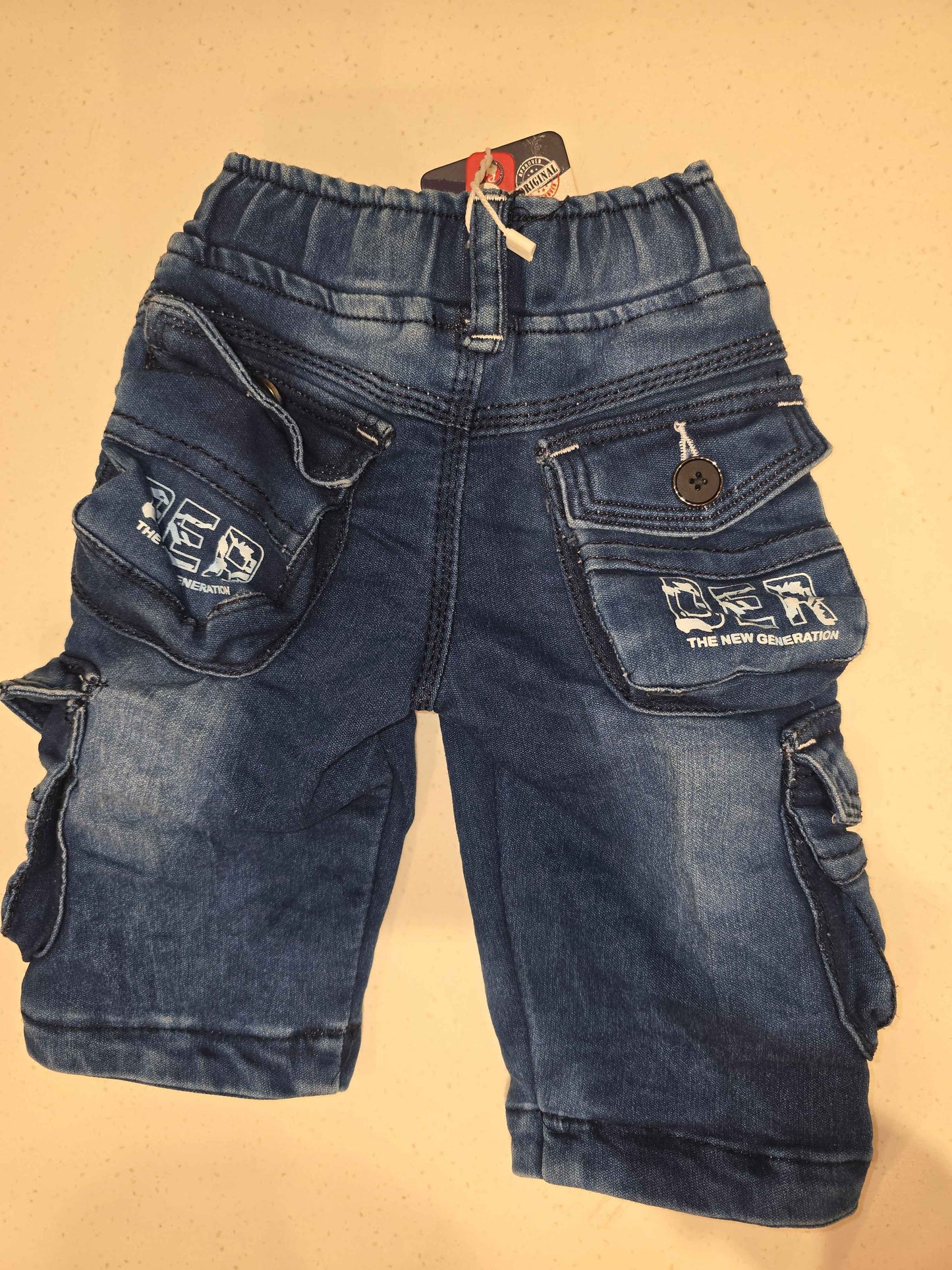 Denim material cargo shorts for boy with printed and round Elasticable with long tie