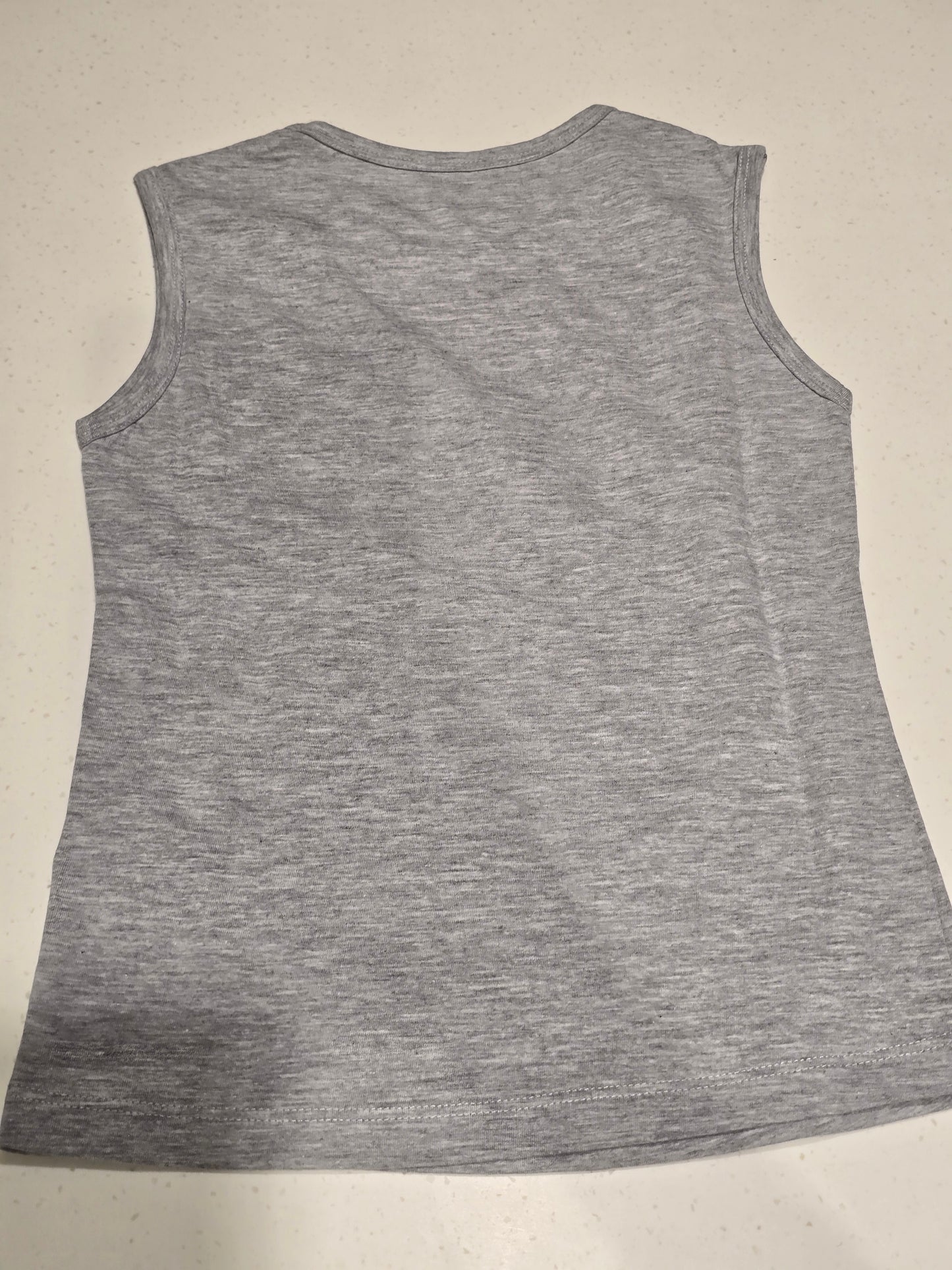 grey sleeveless graphic top or dress featuring a pink flamingo illustration alongside the motivational quote,