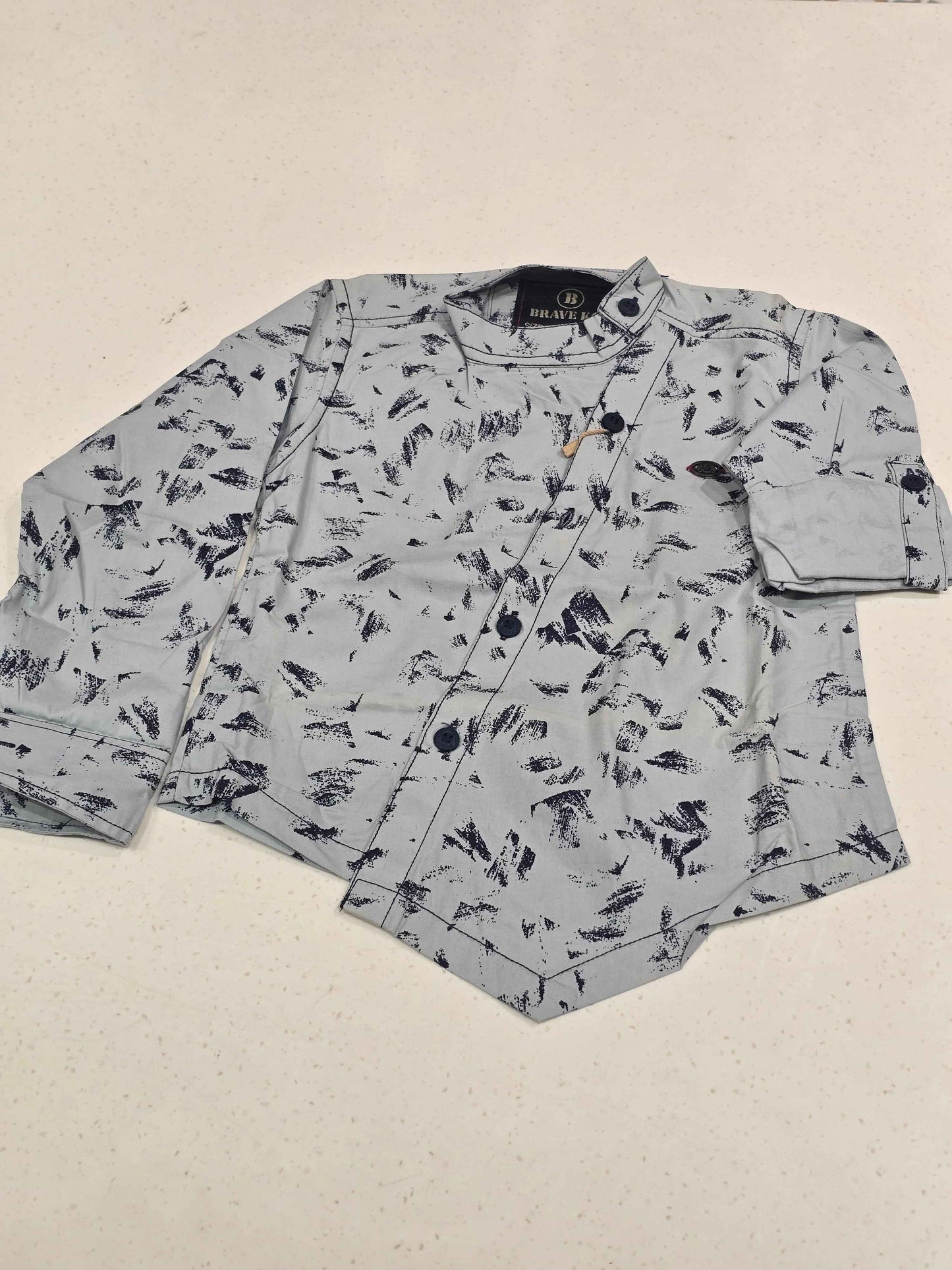 Cotton material white based wuth black printed shirt for boy