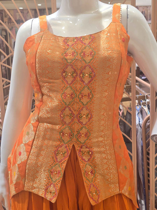 Crush banarasi material orange colour sharara set wuth speghetti neck