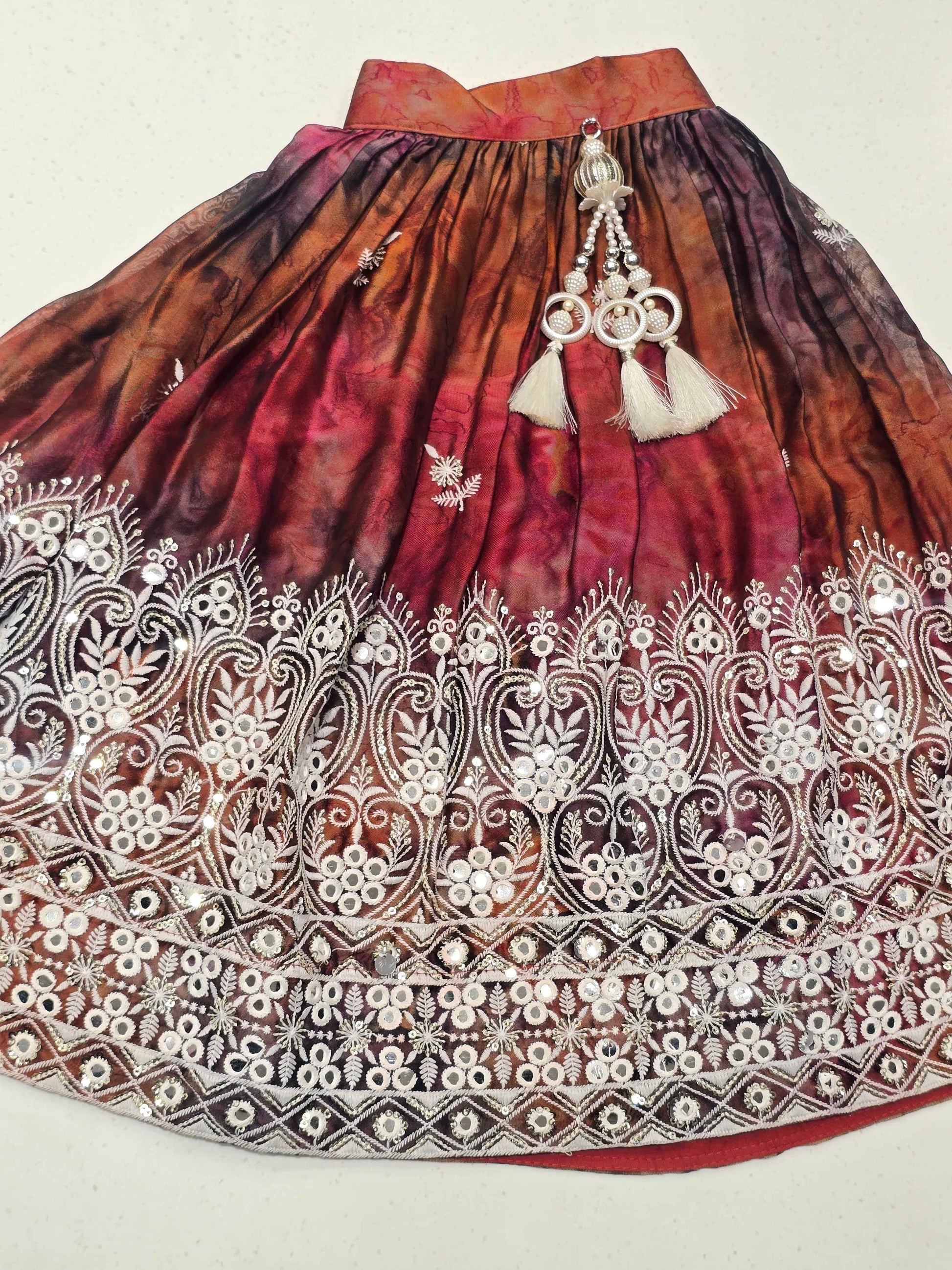 traditional girls' maroon and brown shades lehenga choli set.