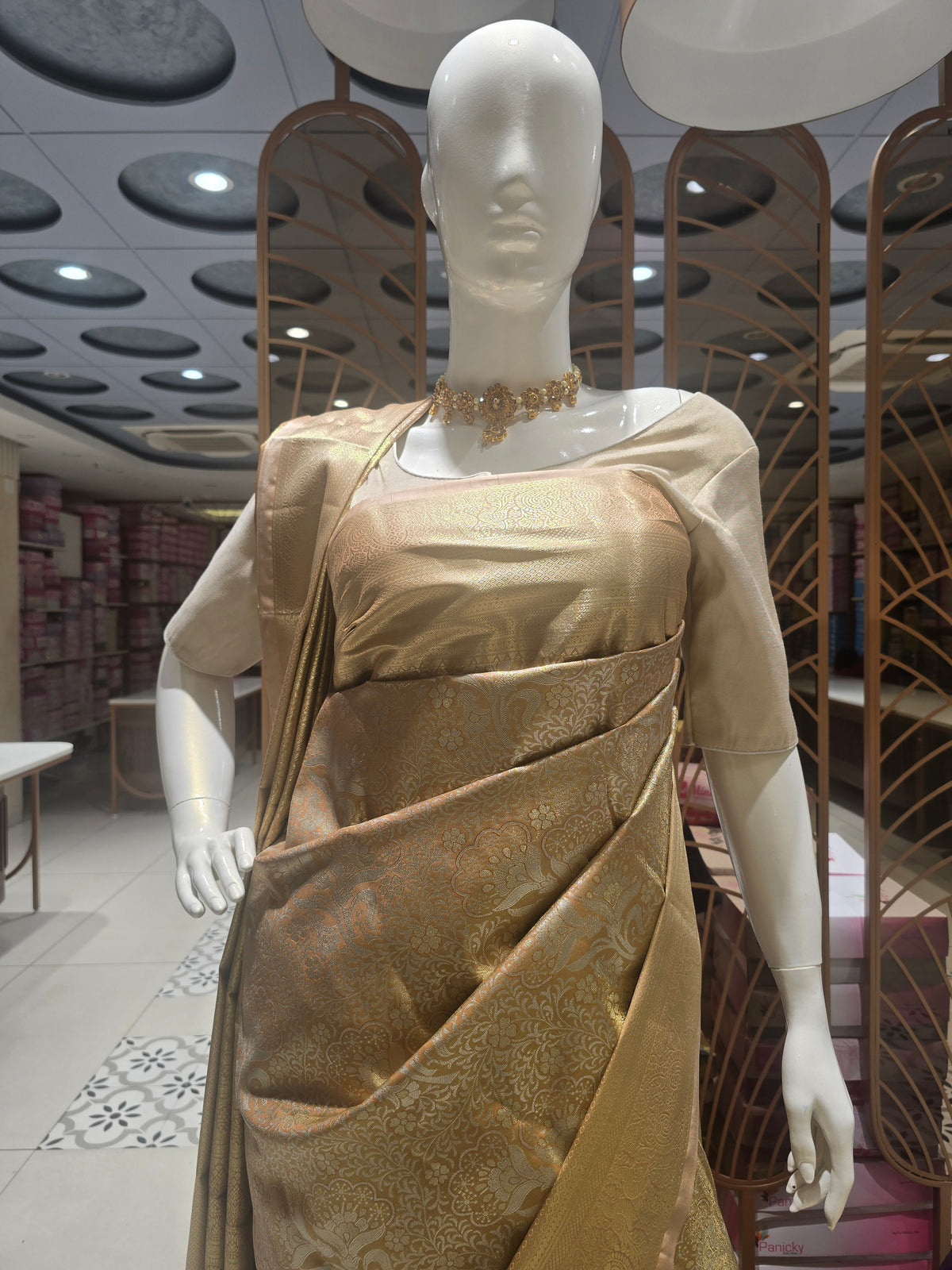 golden-toned semi silk saree.