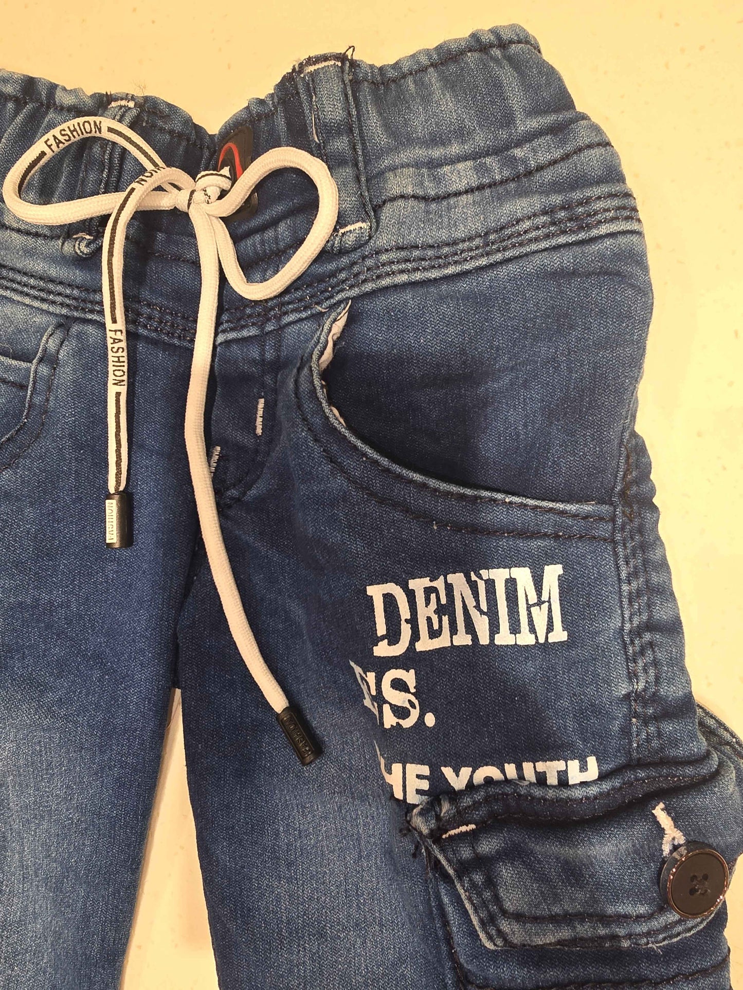 Denim material cargo shorts for boy with printed and round Elasticable with long tie