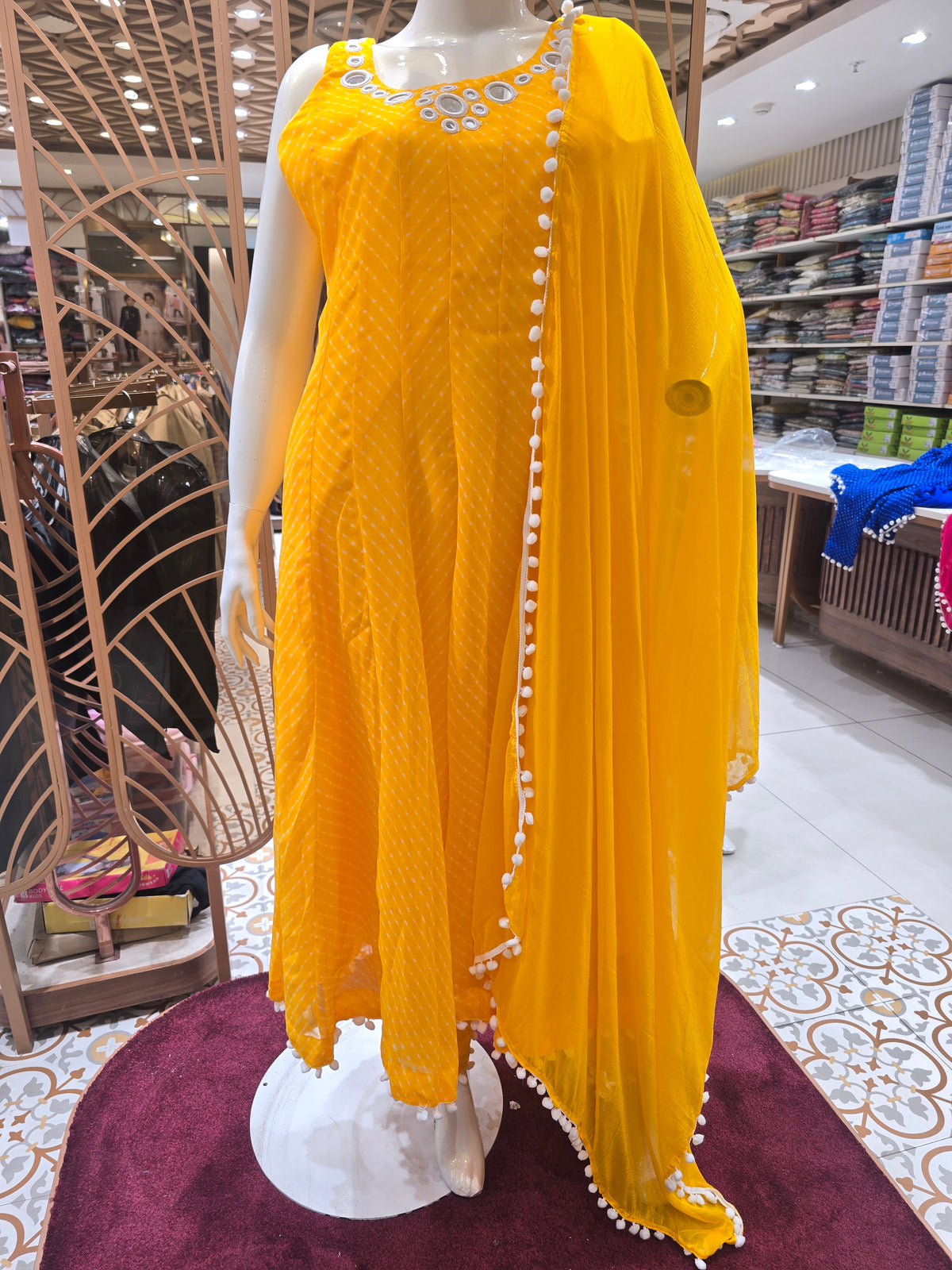 vibrant yellow Anarkali suit set.