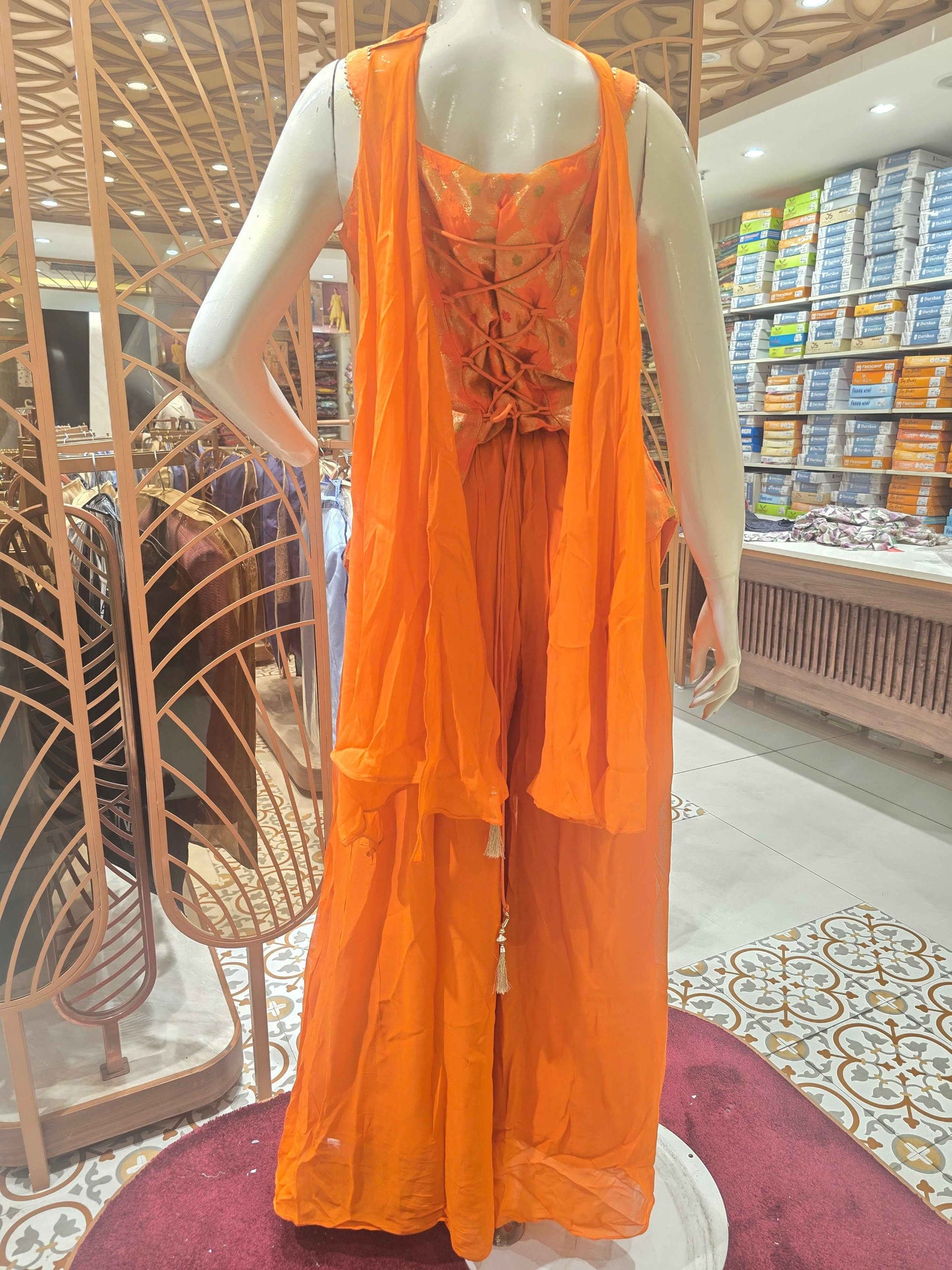 Crush banarasi material orange colour sharara set wuth speghetti neck