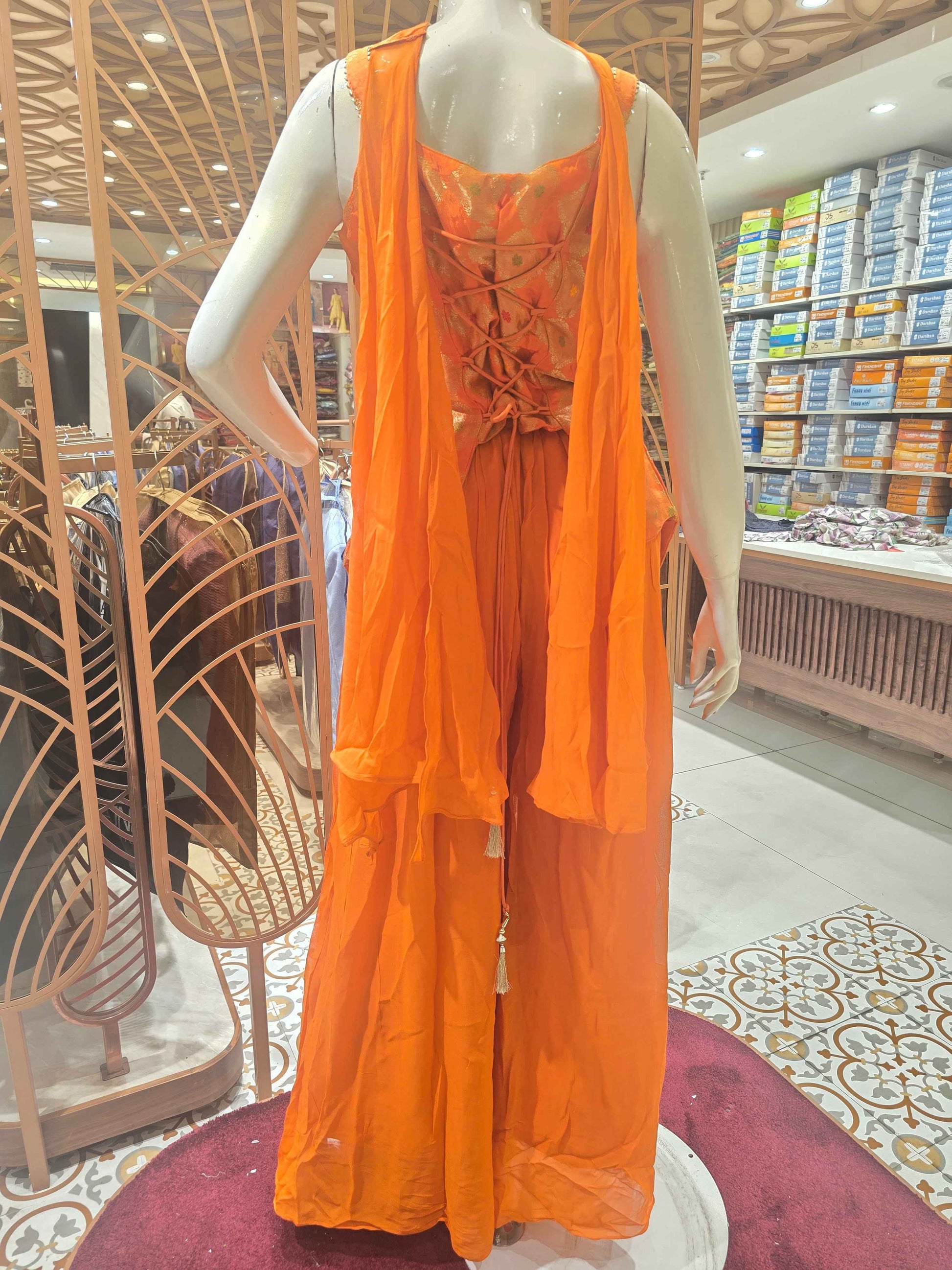 Crush banarasi material orange colour sharara set wuth speghetti neck