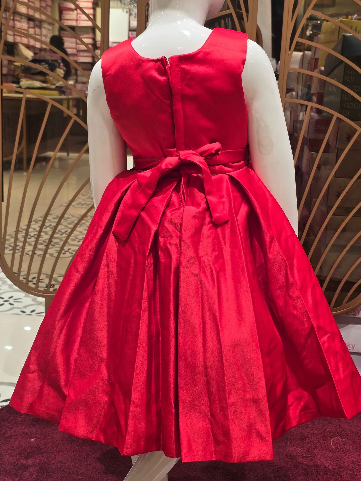 Satin material red colour baby frock with stone work belt on waist and floral cut work