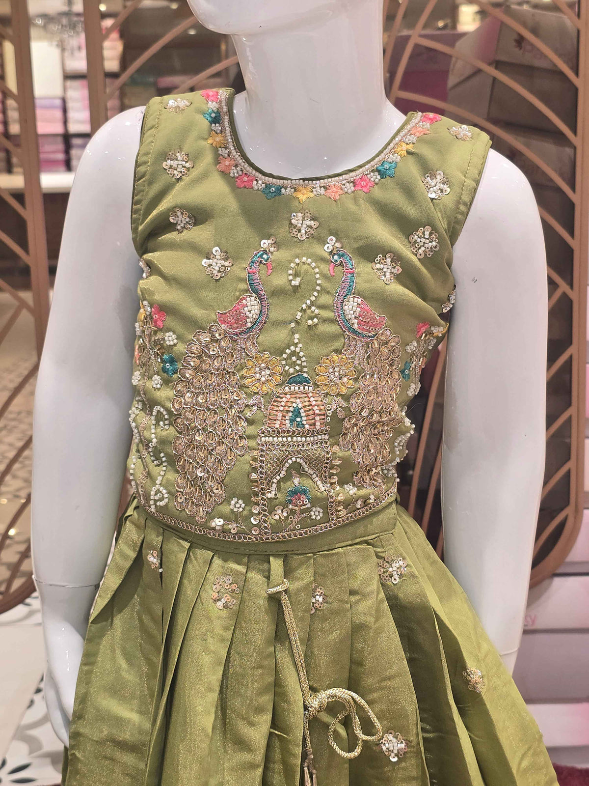 Chinon material yellow colour ethnic wear. beats & sequence work on peacock designed top and thread work on round neck, with ladkans