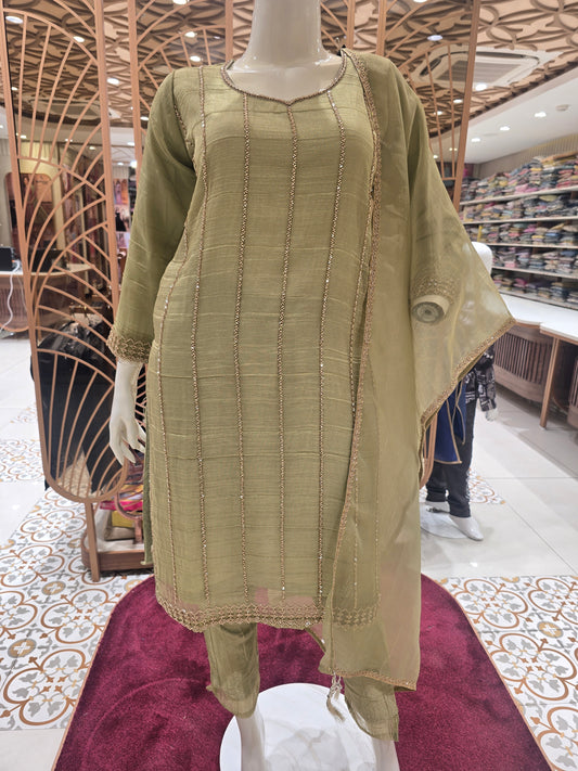 olive green ethnic salwar suit styled with subtle vertical shimmer stripes and delicate beadwork along the seams.