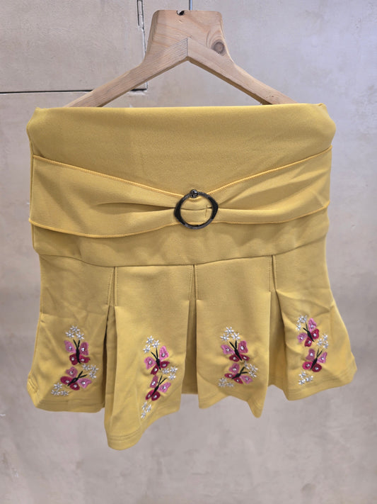 Girls Lycra Cotton Casual Wear Skirt in Yellow with Bow Style Design and Floral Printed Border for Summer Wear