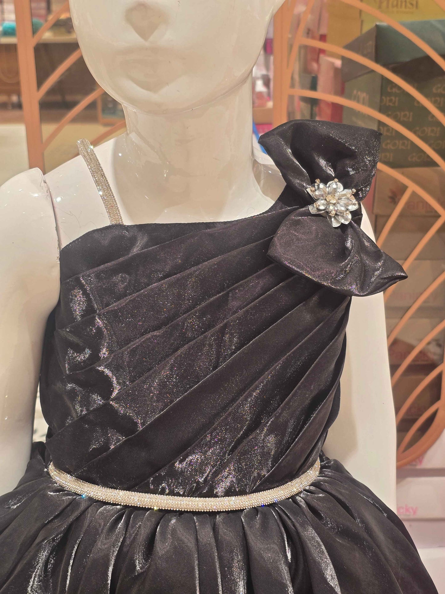 Satin material black coloured party wear frock with speghetti on right side and bow on left