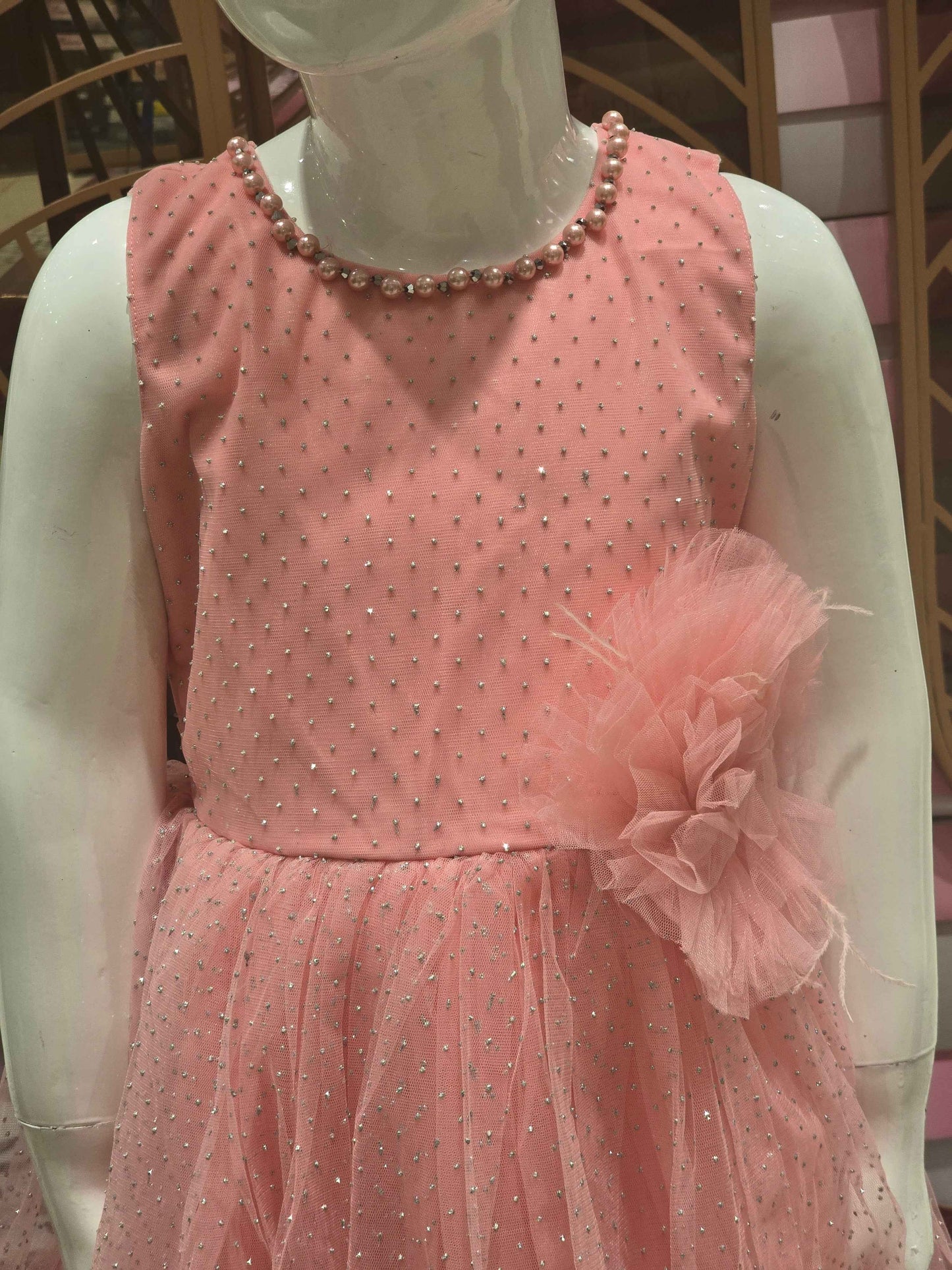Doted Glitter Knitted material peach coloured bushi gowns with beats work on neck and flower design on waist