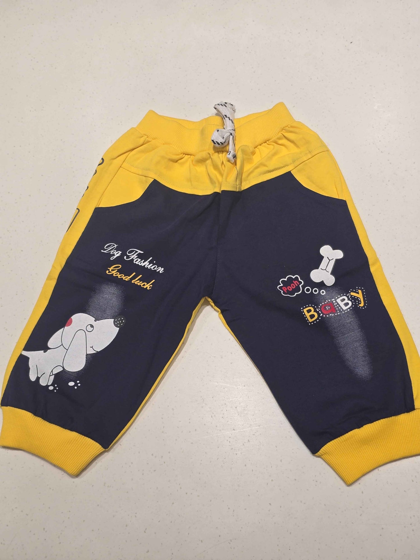 Cotton material yellow with blue color ¾ shorts with rubber prints