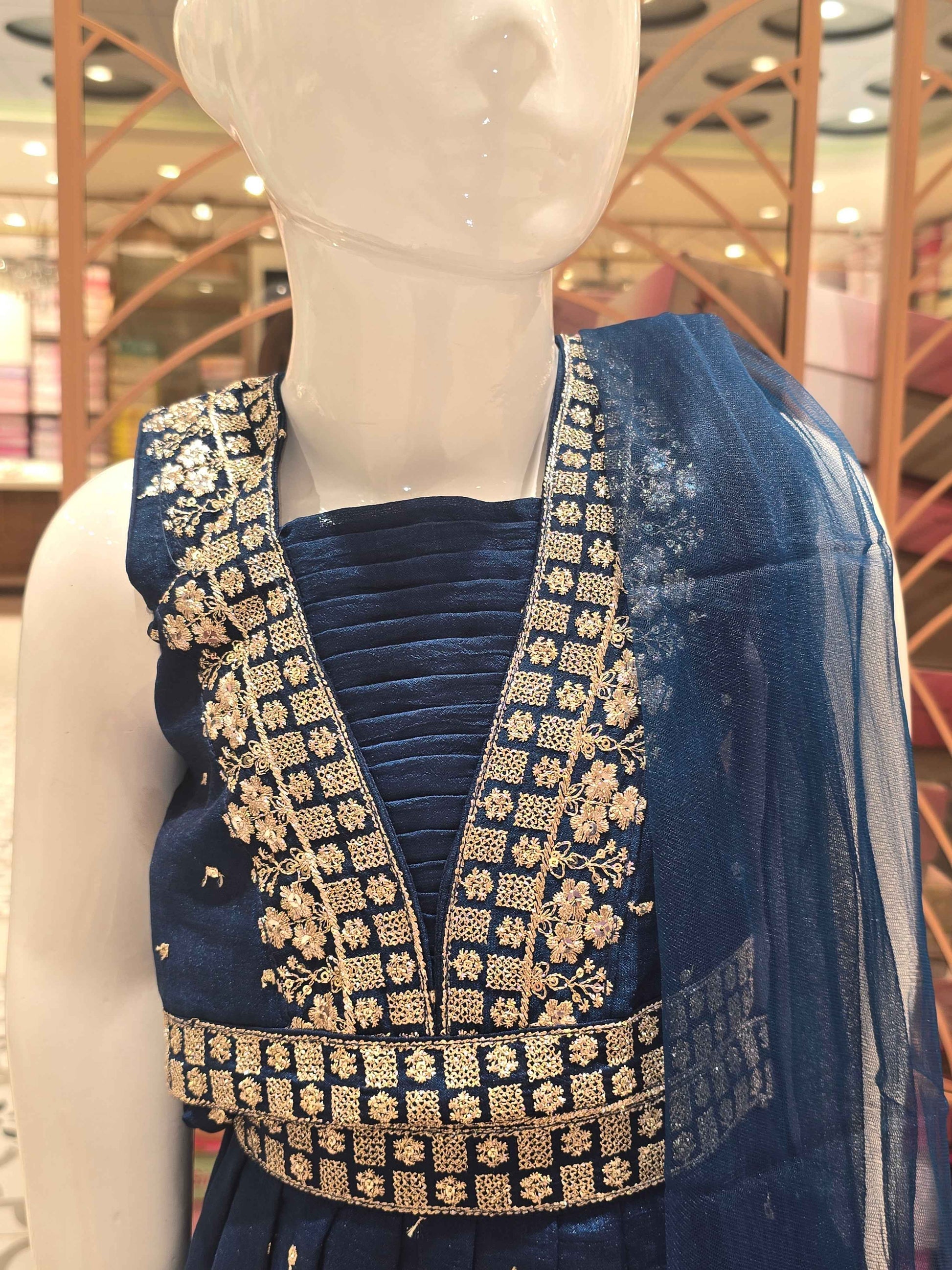 Chinon material Teel blue colour gaghra choli with zari embroidery on v styled neck. Small zari buta and traditional border