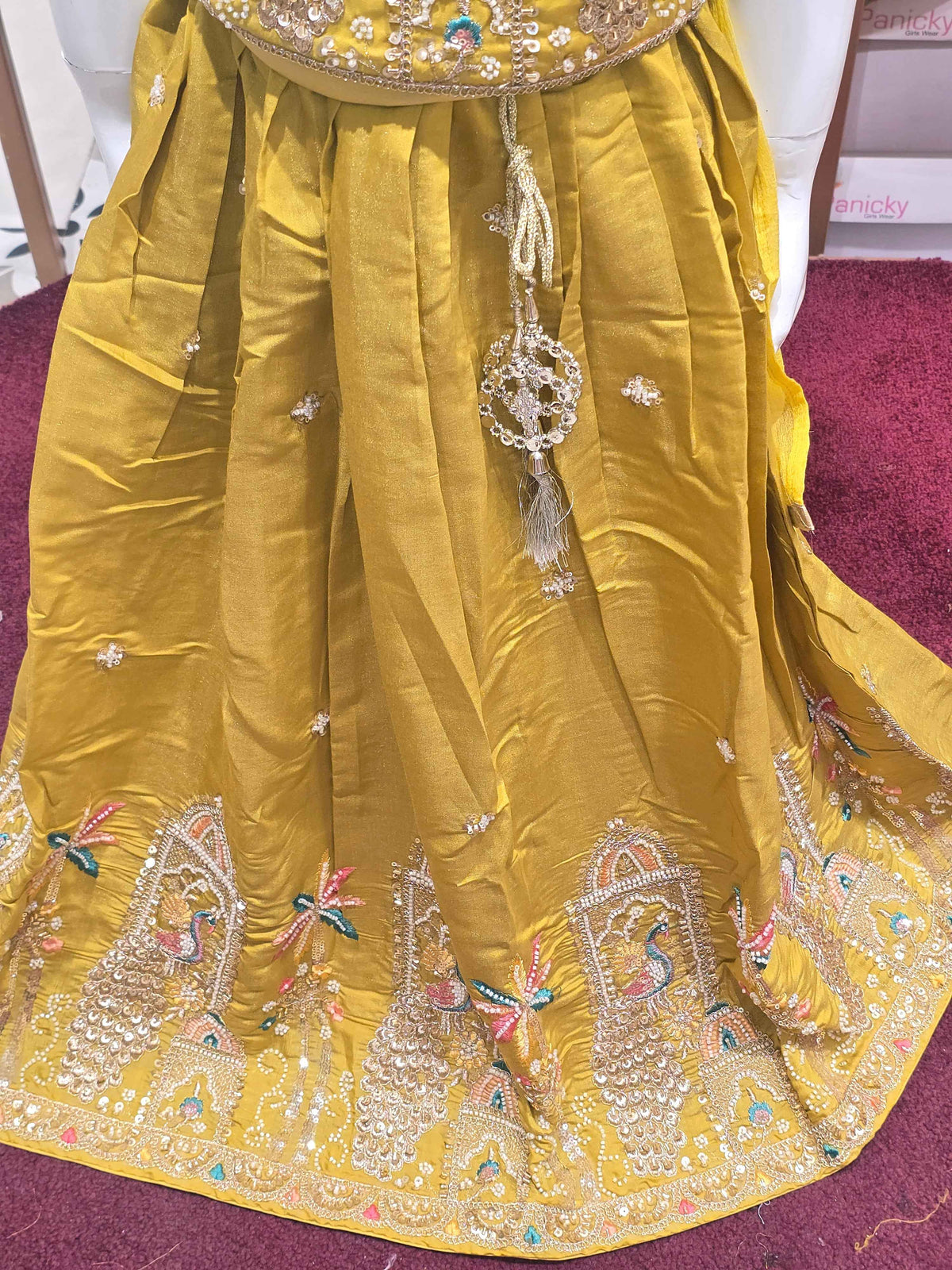 Chinon material yellow colour ethnic wear. beats & sequence work on peacock designed top and thread work on round neck, with ladkans