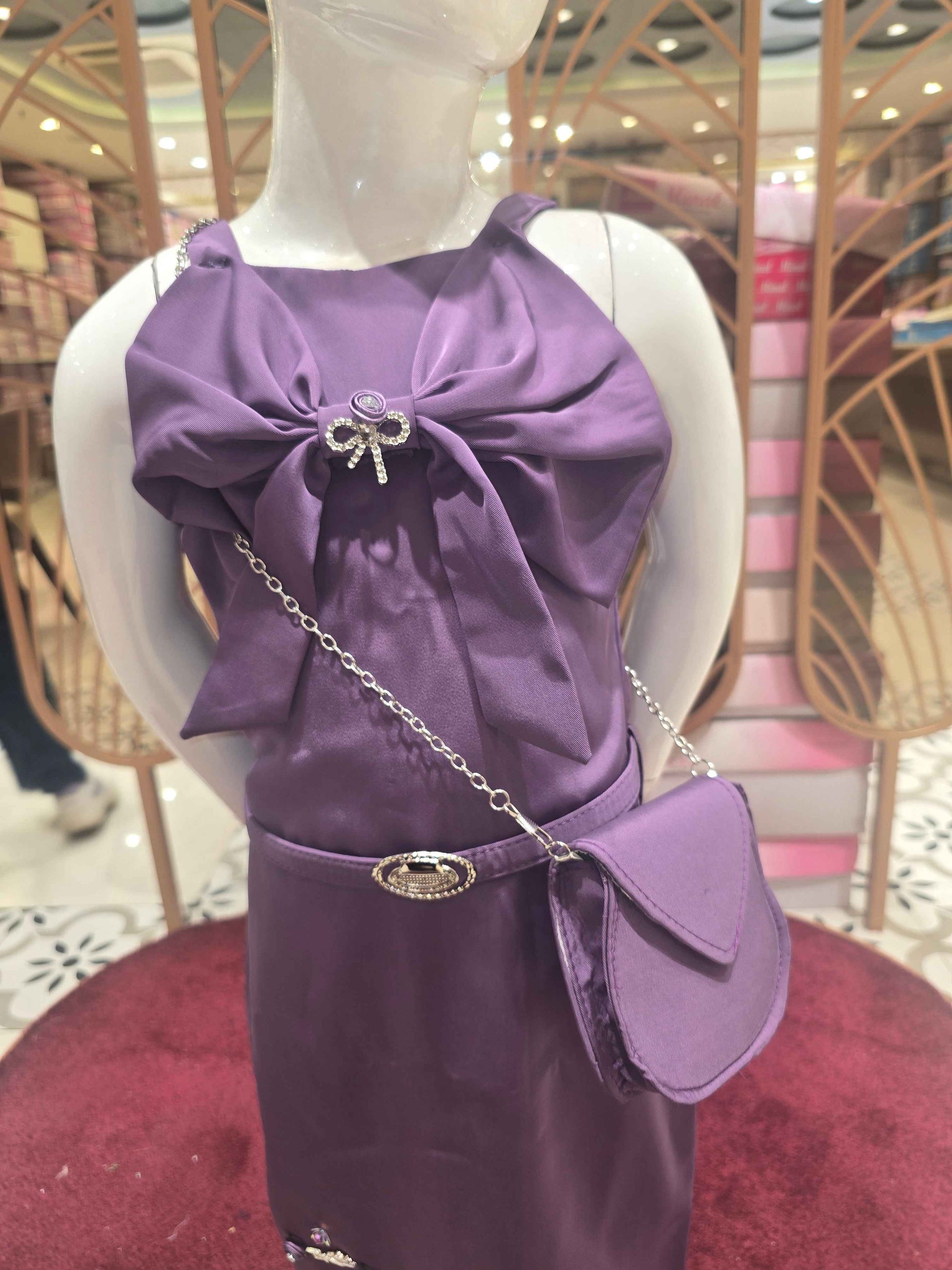 Satin material purple colour western bodycon with speghetti and bow styled design. An elegant smart bag