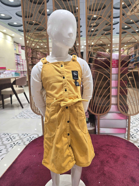 Corduroy material mustred with white colour dangri frock with tieing and 2 pockets