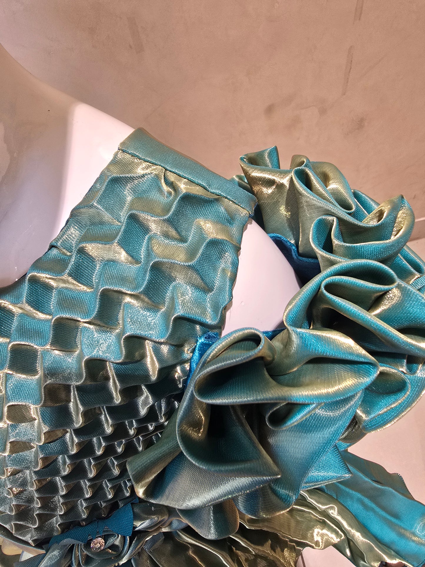 Shining Satin material green colored short frock with cold buff Sleeves , attached waist flower design