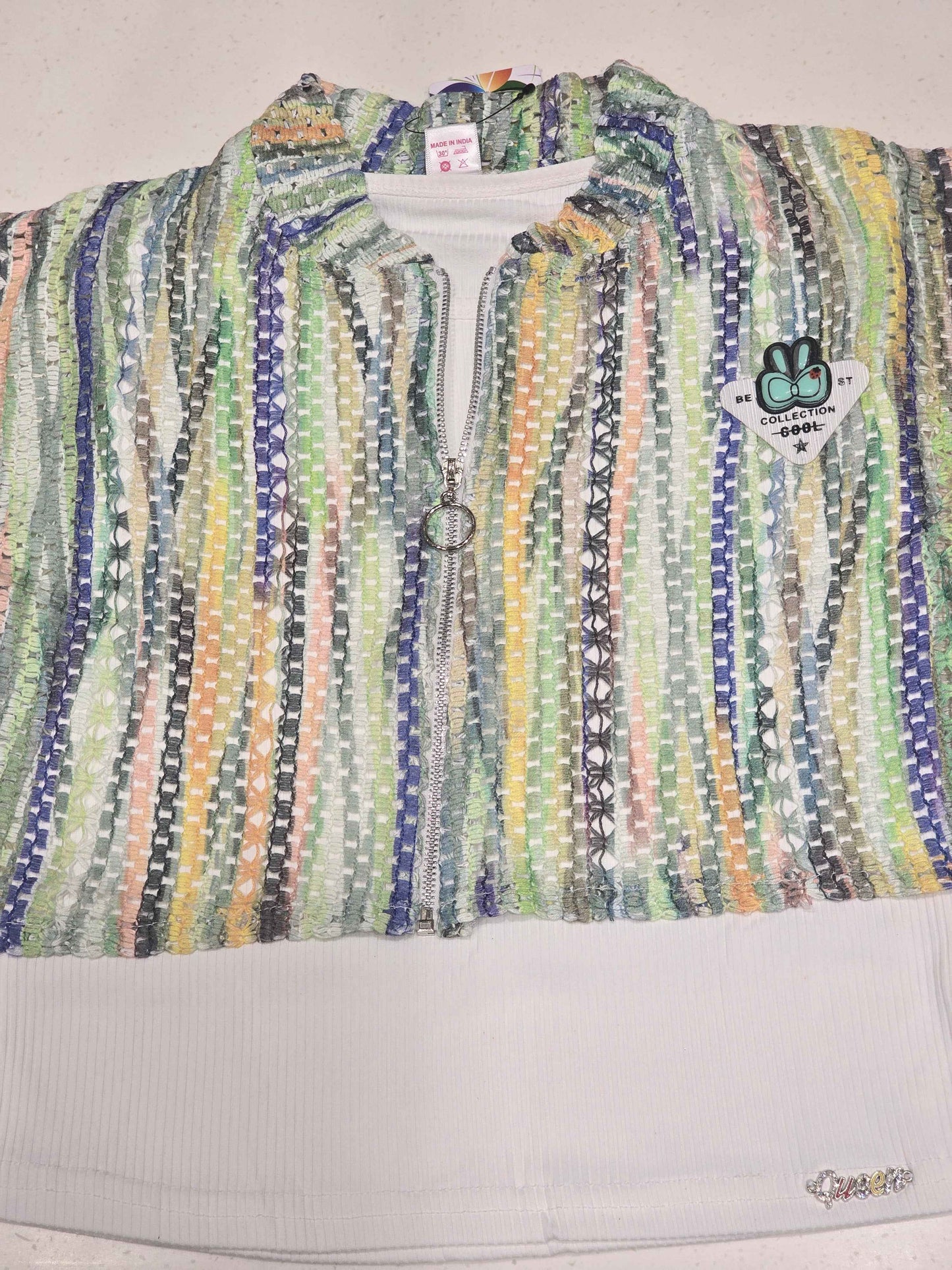 girls' two-piece knit clothing set featuring a multi-colored striped mesh zip-up crop shirt layered over a solid white tank top.
