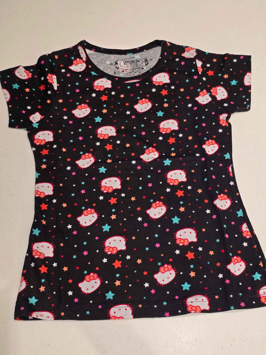 black Hello Kitty t-shirt / short night dress decorated with an all-over repeating print of Hello Kitty faces and multi-colored stars.