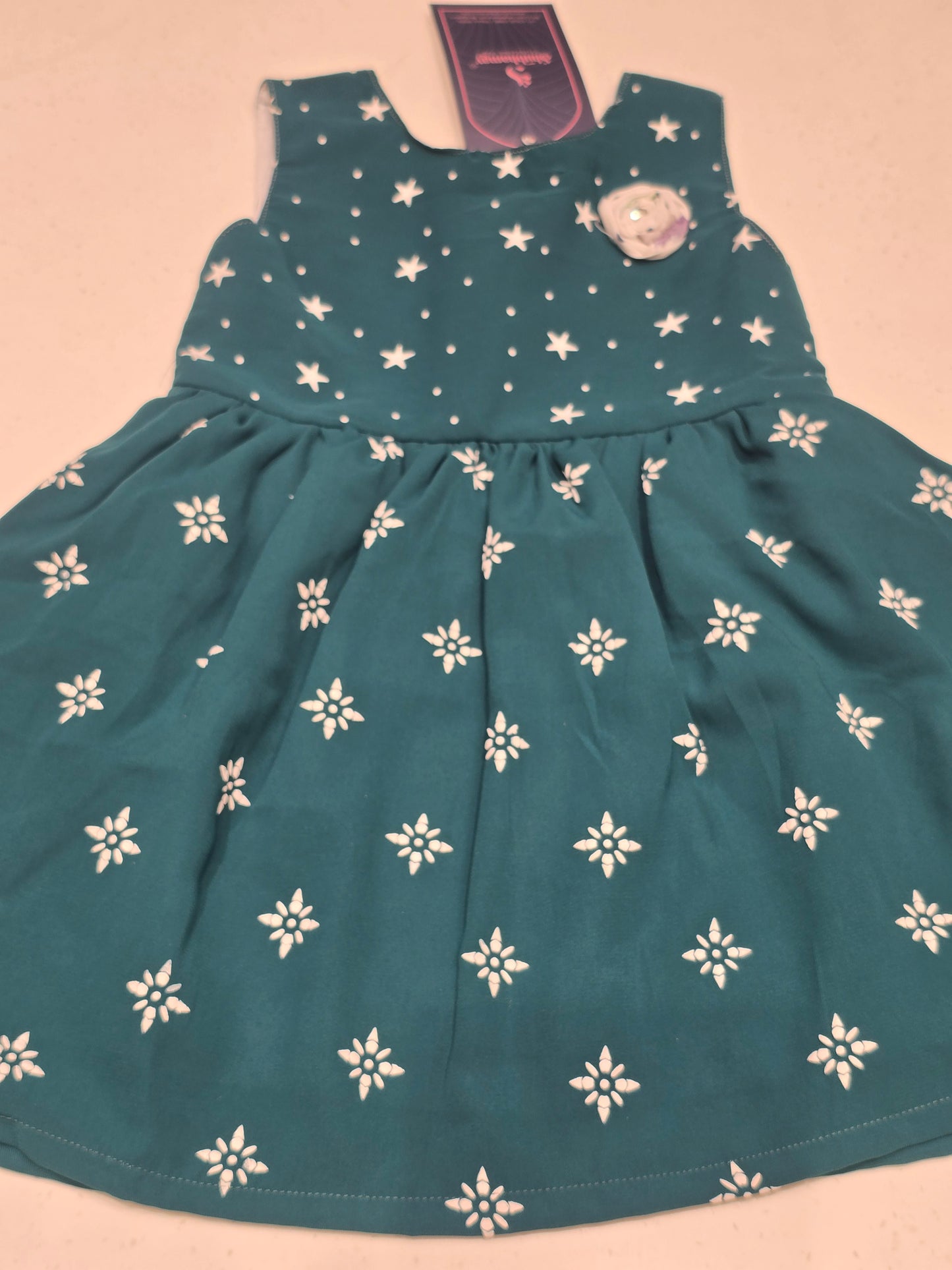 Cotton material peacock blue color baby frock with round neck