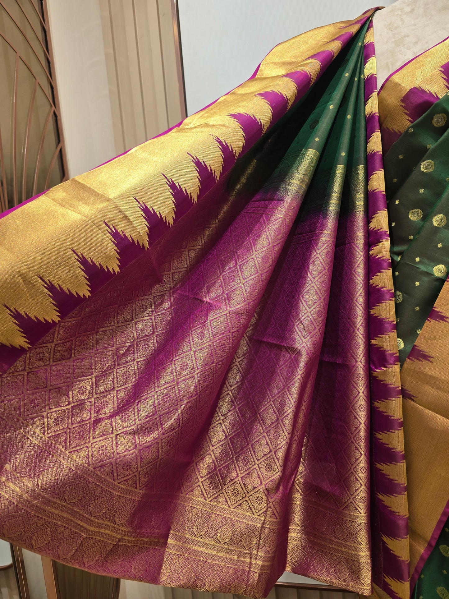 Pure handloom Kanjivaram silk saree with temple border and traditional motifs