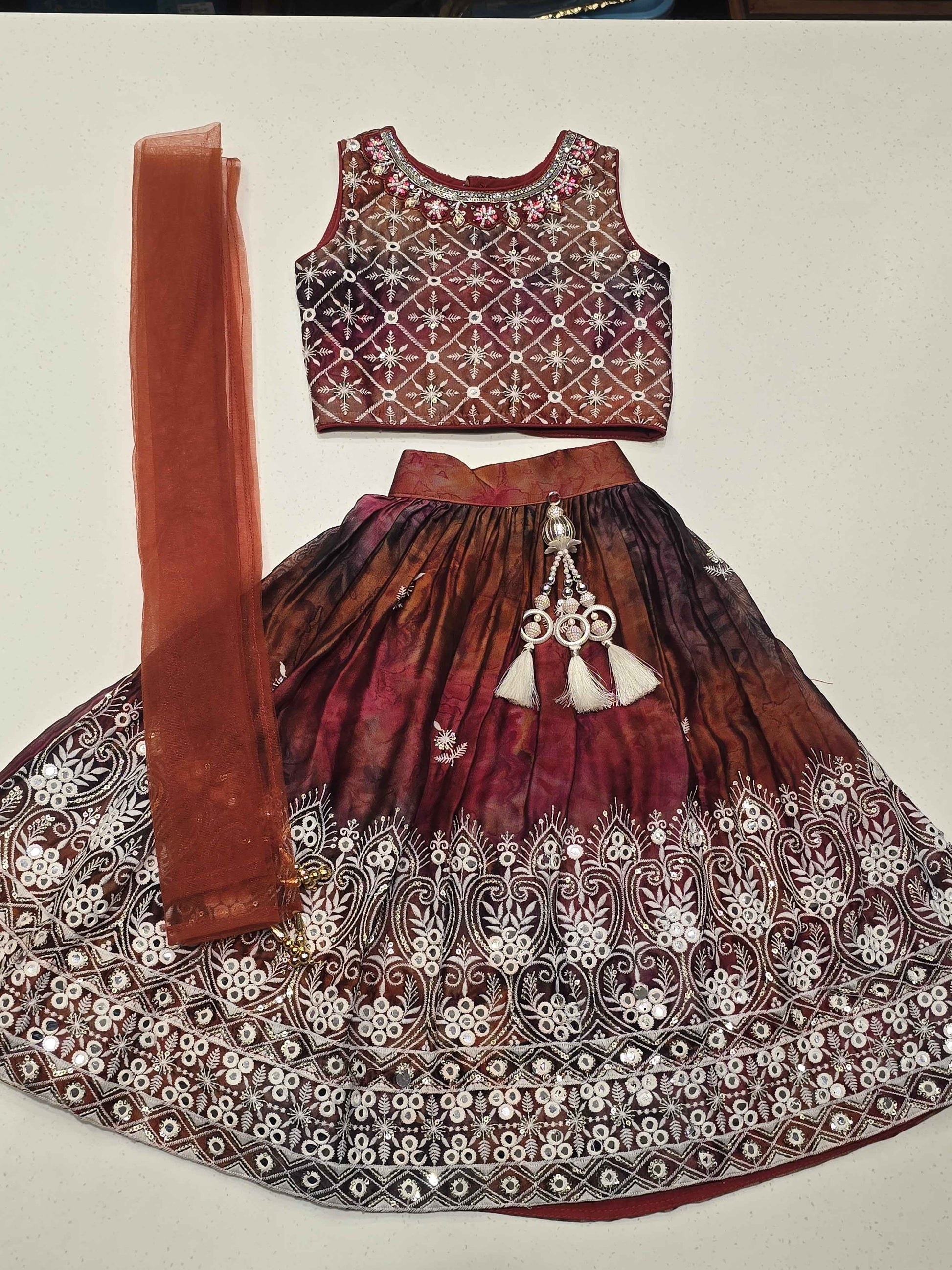 traditional girls' maroon and brown shades lehenga choli set.