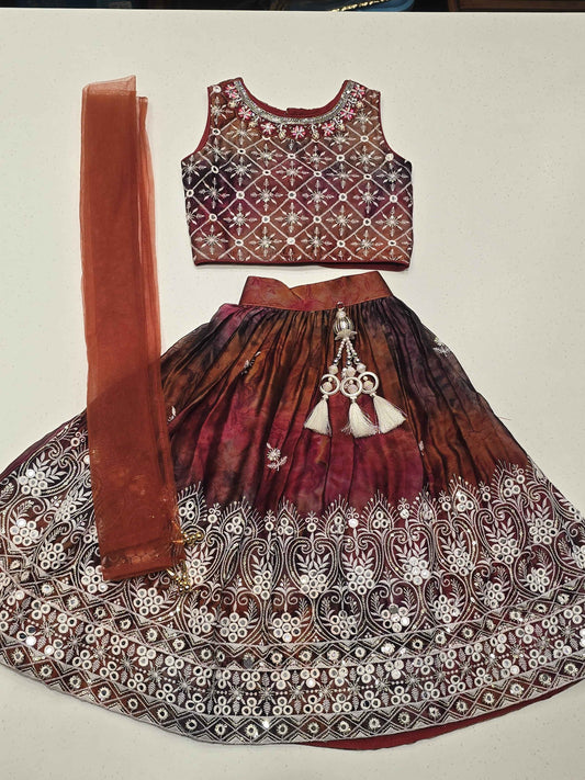 traditional girls' maroon and brown shades lehenga choli set.