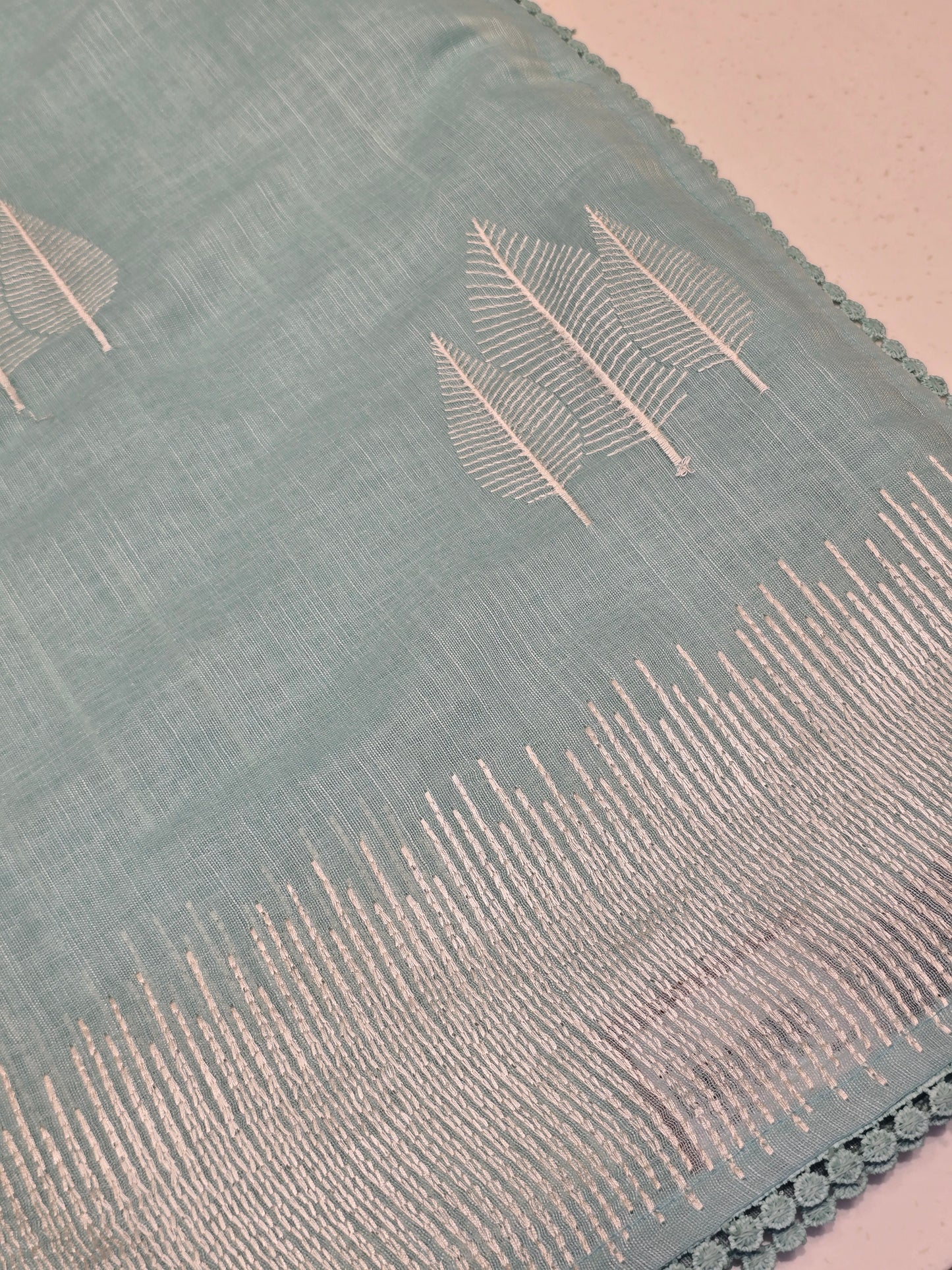 Linen with embroidery border and leaf motif Normal wear