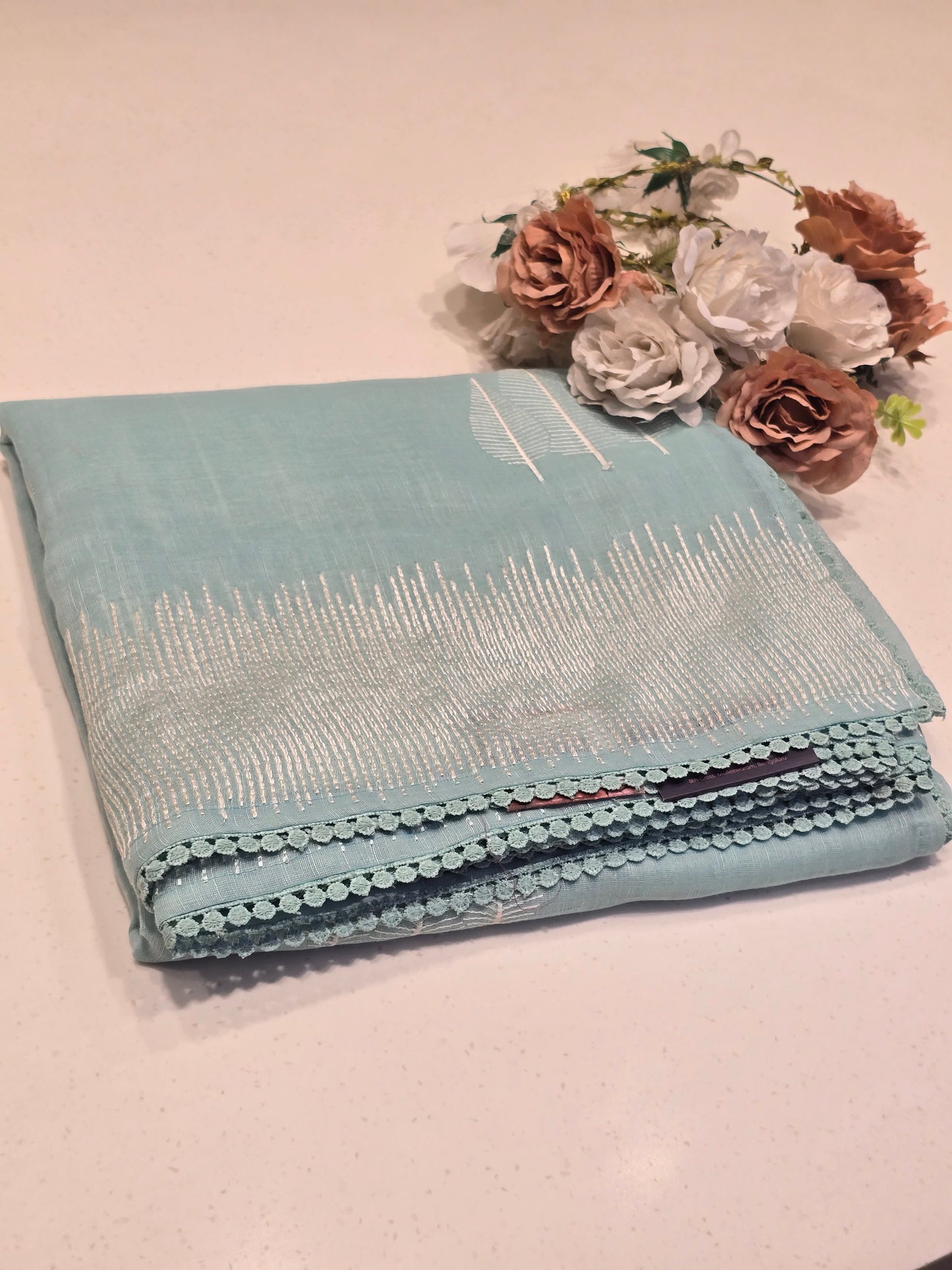 Linen with embroidery border and leaf motif Normal wear