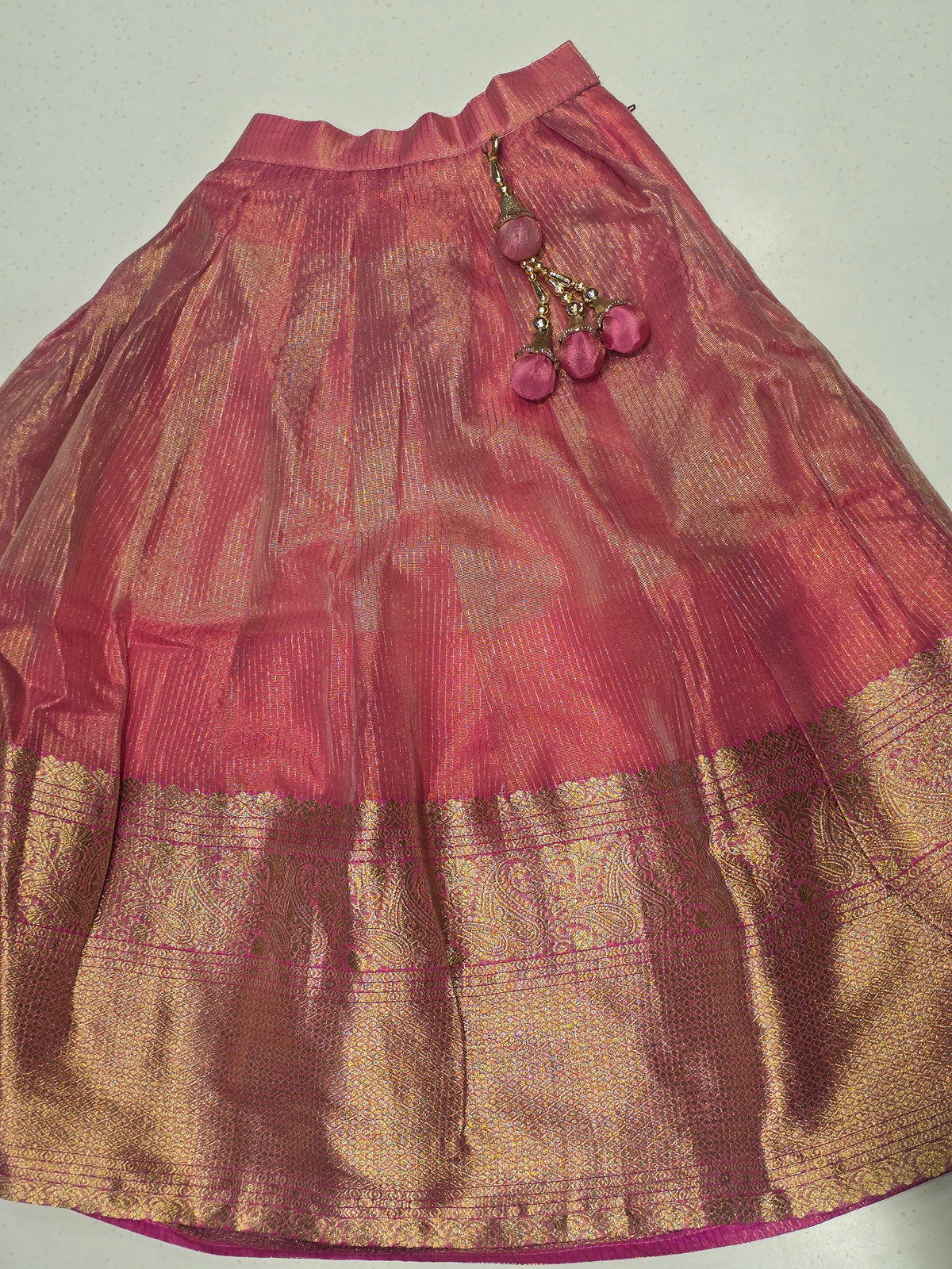 pink and gold lehenga choli set for kids (also known as a Pattu Pavadai